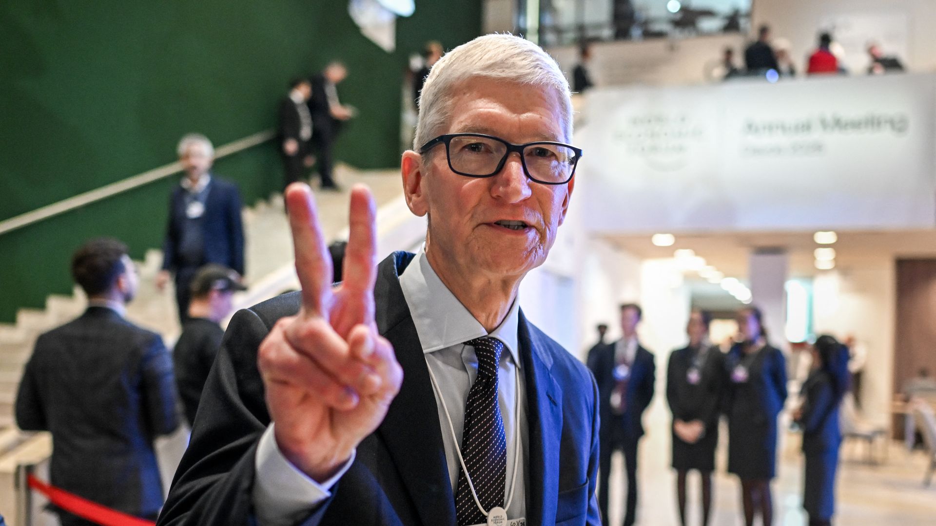 Apple CEO Tim Cook gestures as he departs after a business leaders reception at the World Economic Forum  annual meeting in Davos in January.