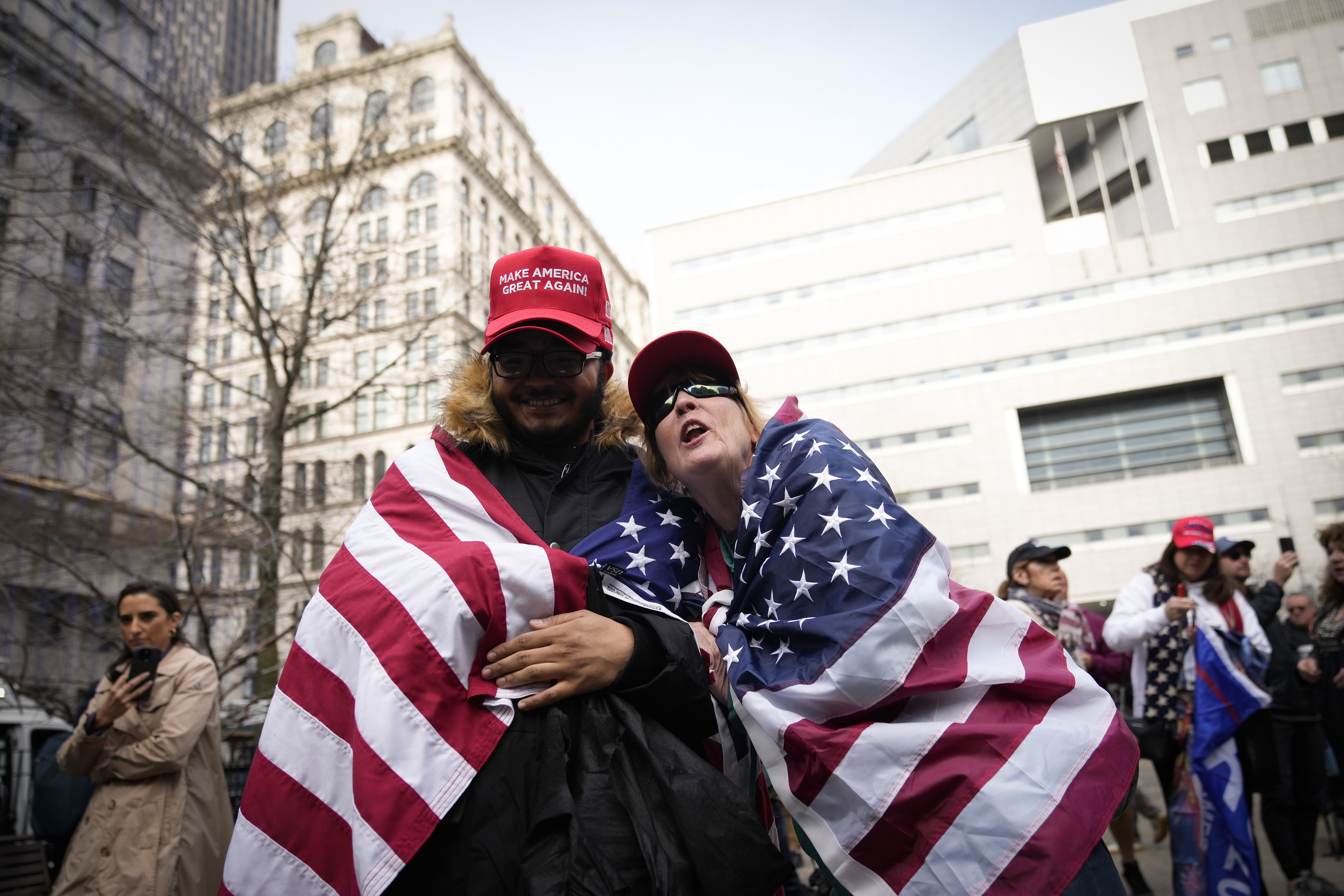 Supporters of former U.S. President Donald Trump gather outside the courthouse where former U.S. President Donald Trump will arrive later in the day for his arraignment on April 4,