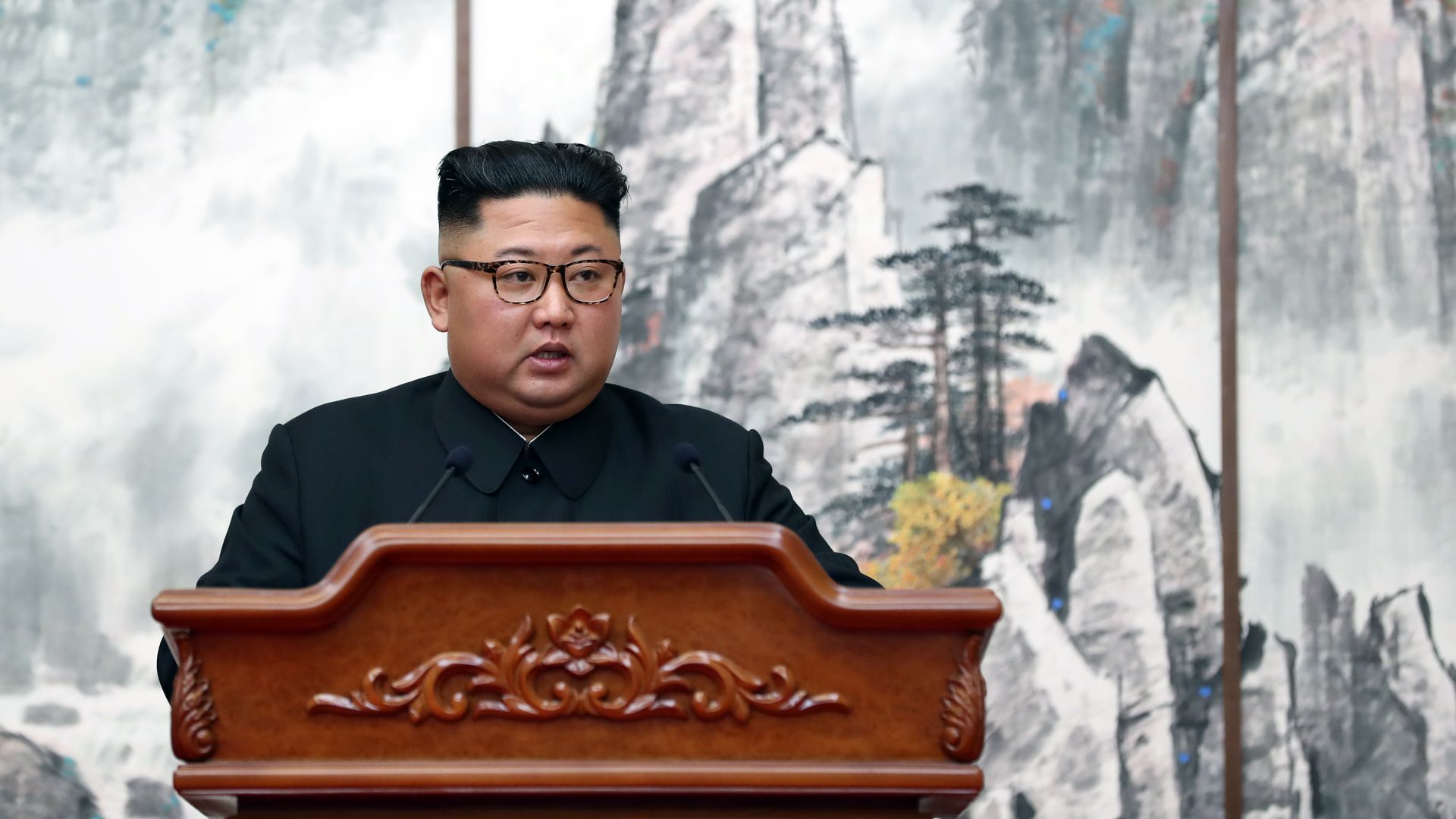 Kim Jong un behind a podium