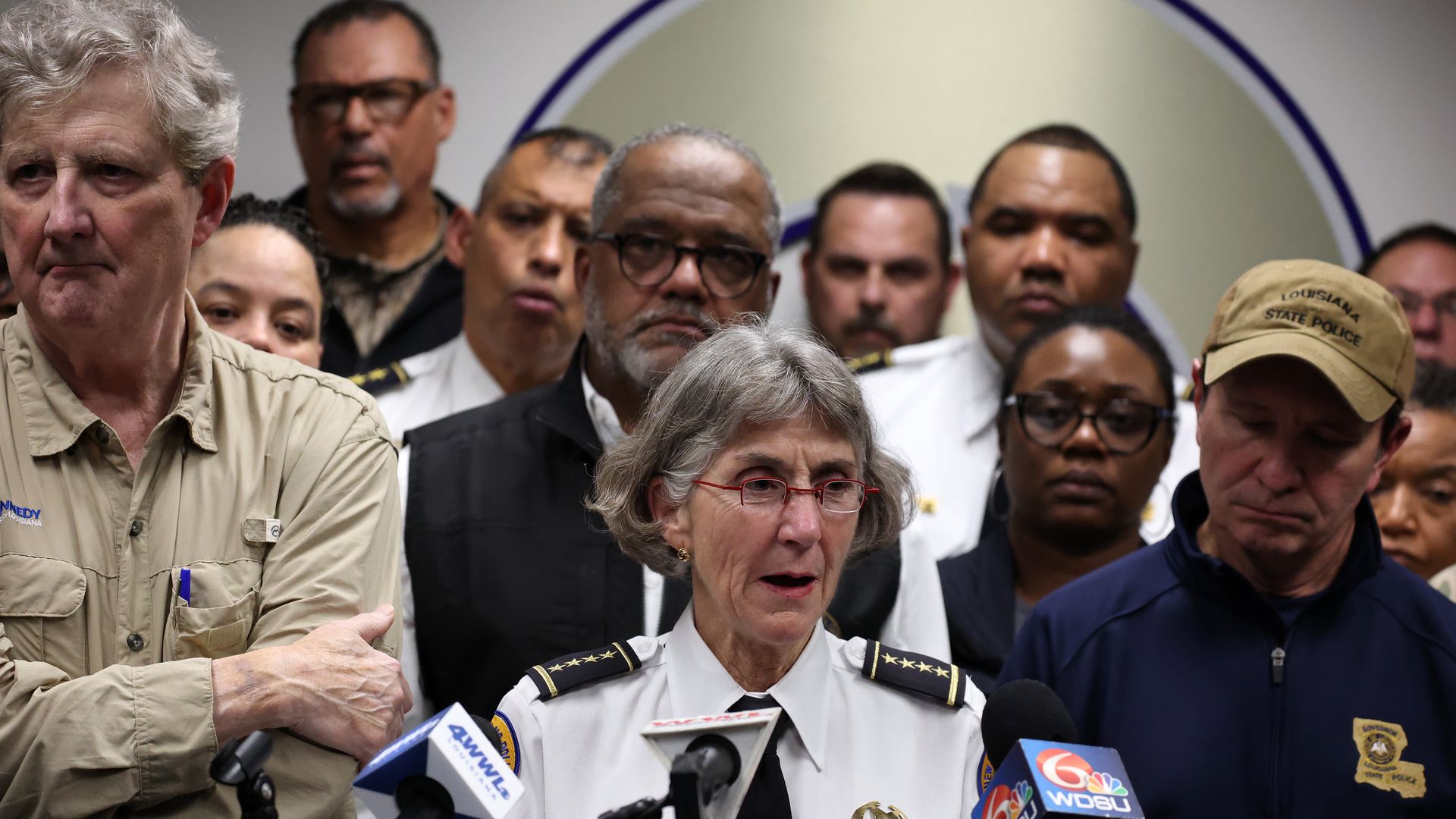 Photo shows Anne Kirkpatrick, John Kennedy, Gov. Landry and other leaders.