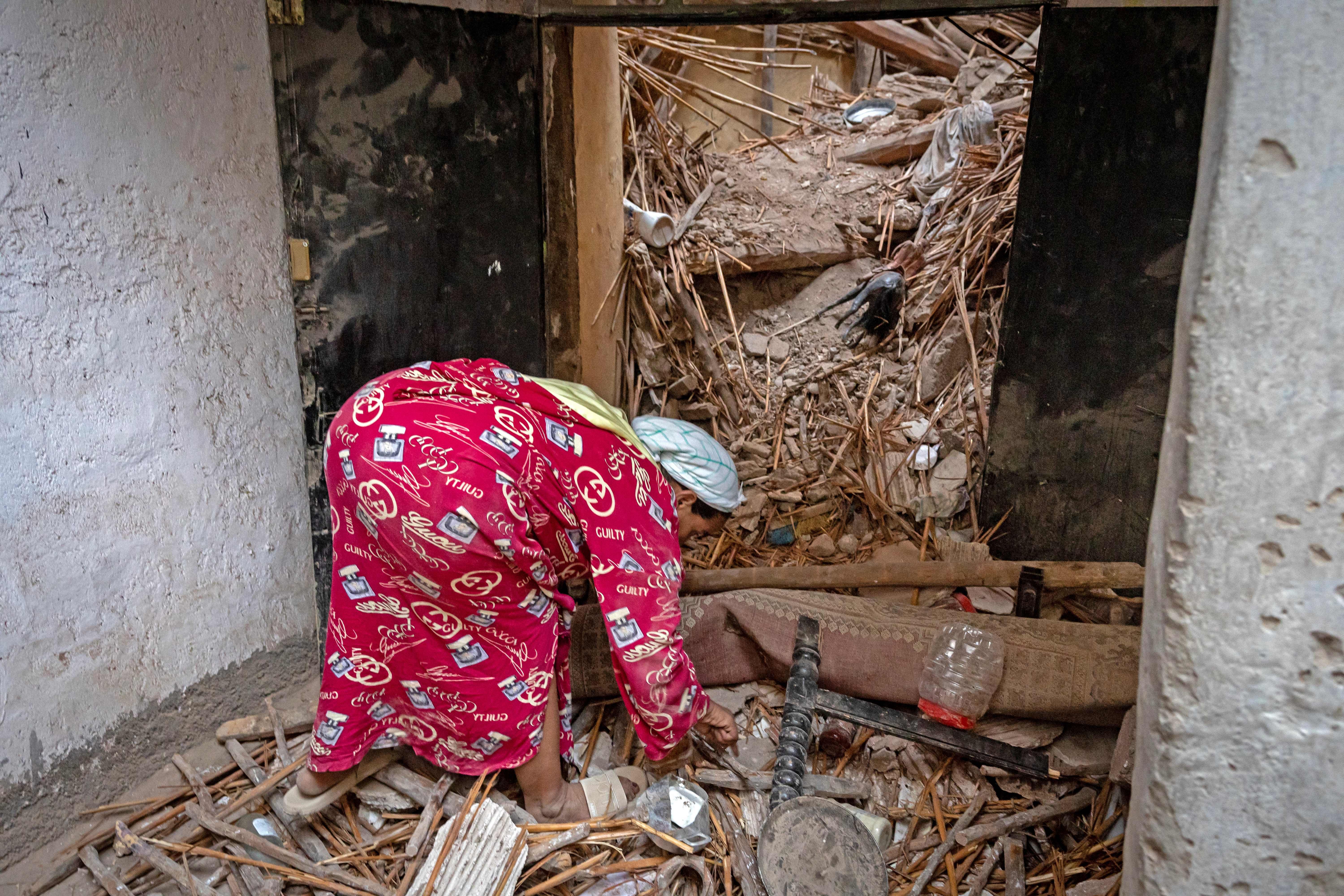 A woman inspects the damage following a 6.8-magnitude quake in Marrakesh. 