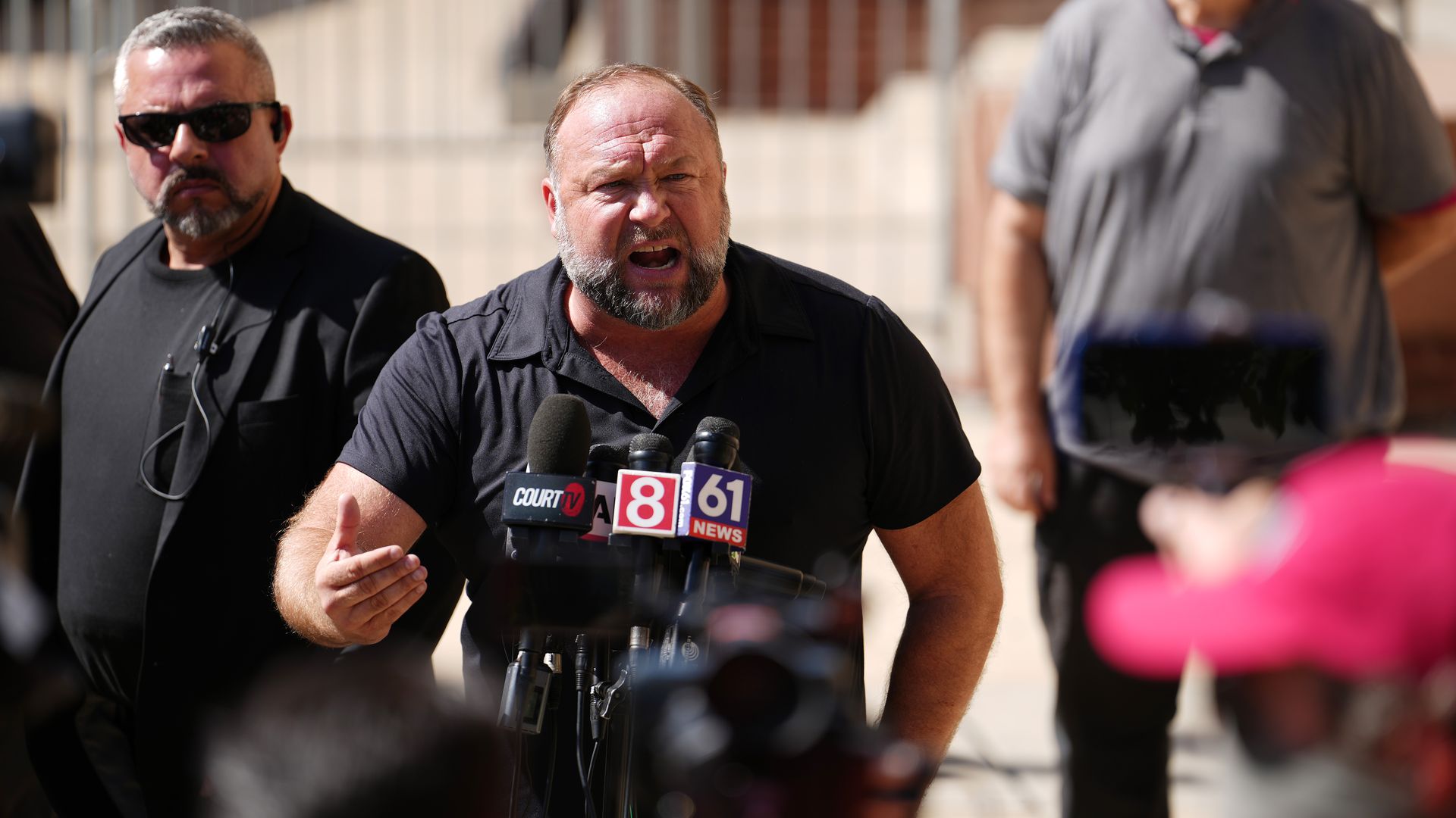 Alex Jones speaks to the media outside Waterbury Superior Court during his trial 