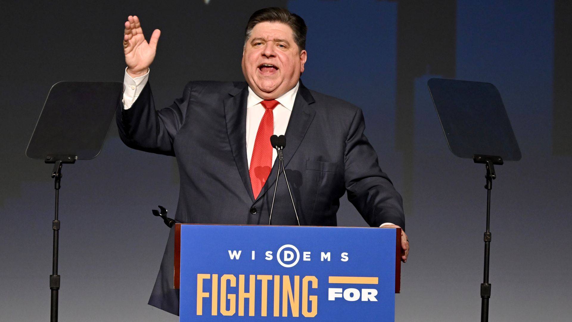 Photo of a man behind a podium 