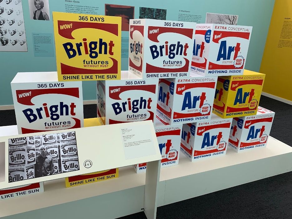 Andy Warhol's artwork turning white Brillo boxes into "Bright futures" boxes.