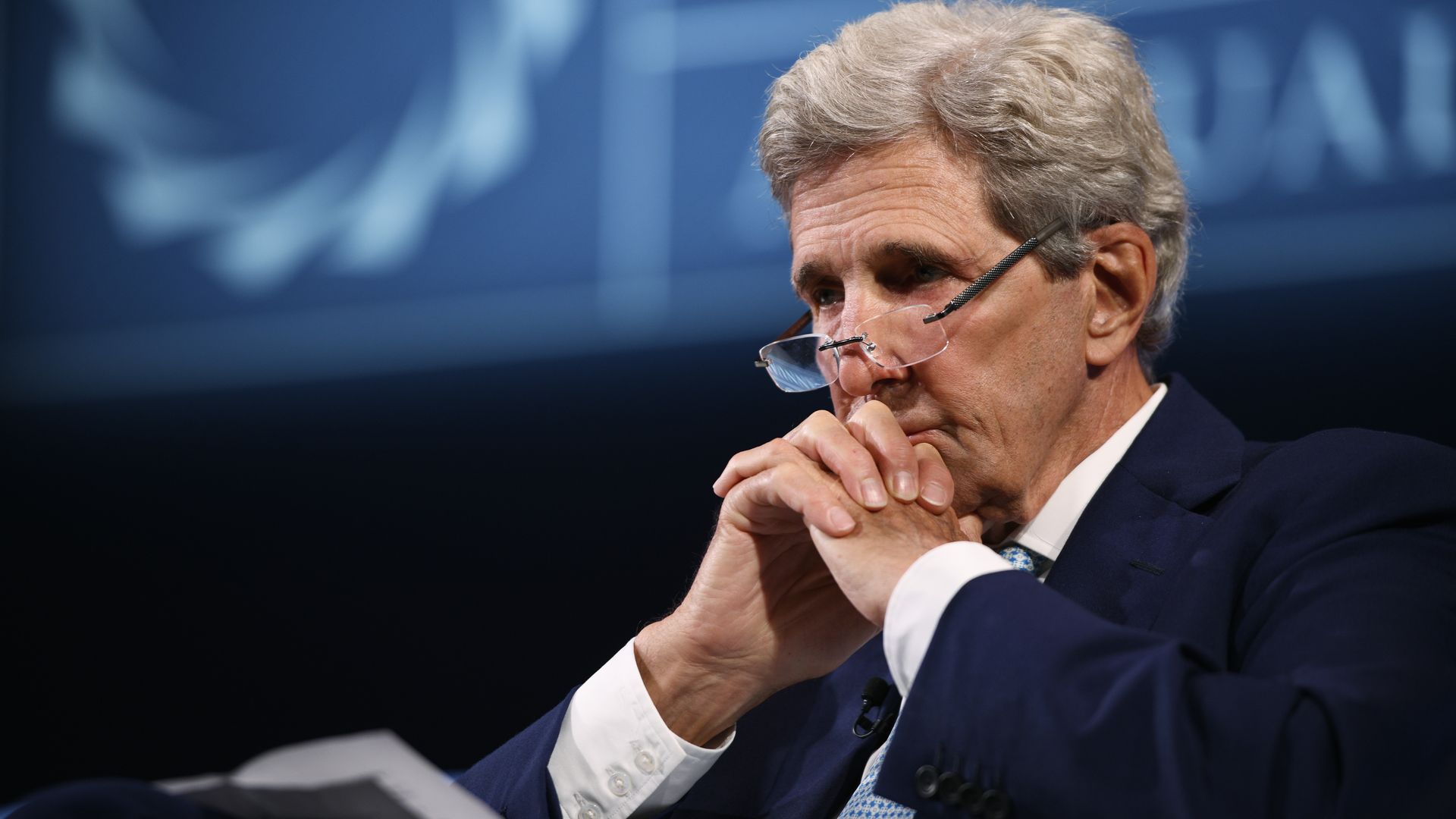 John Kerry sitting.