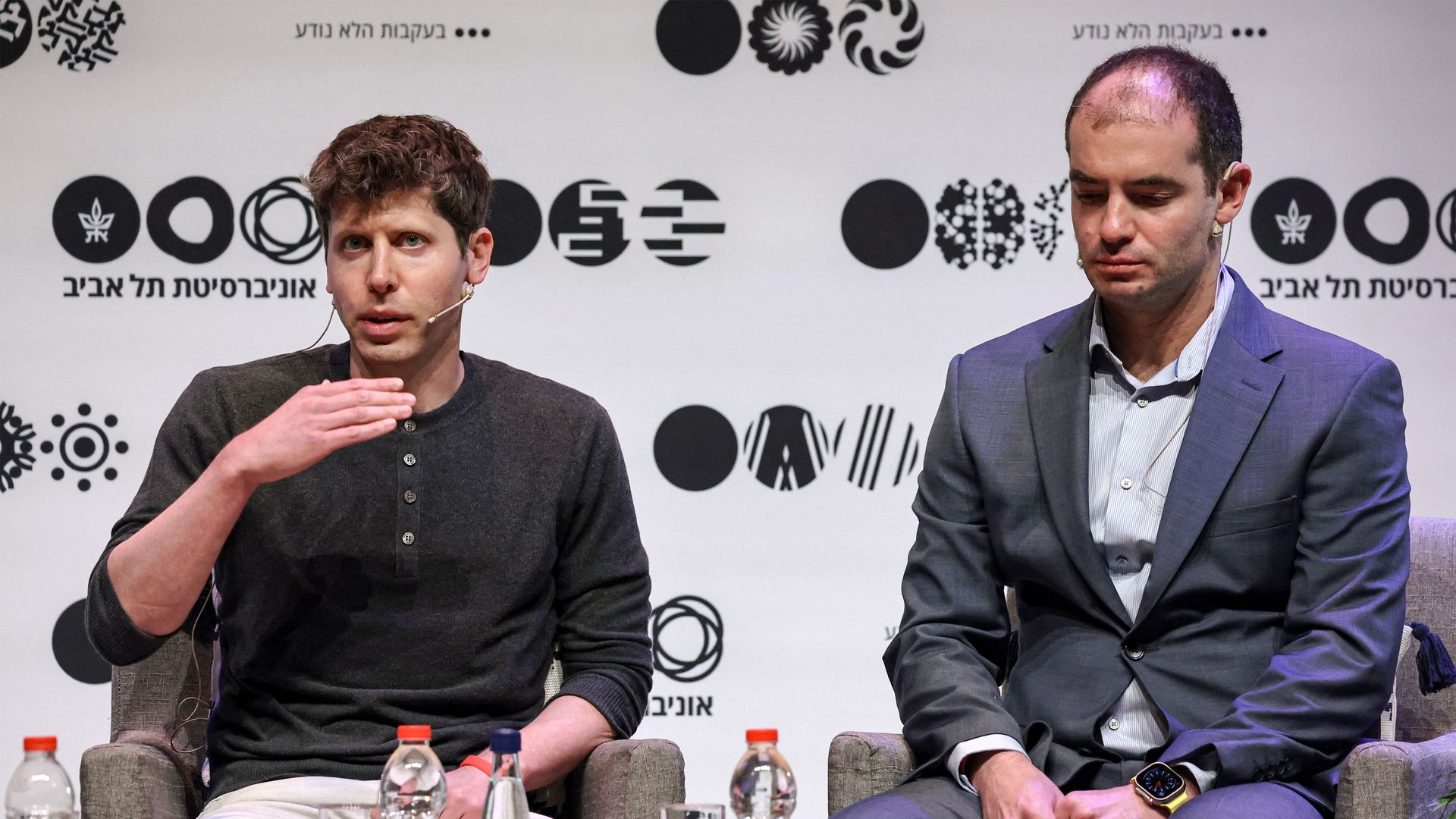 Sam Altman and Ilya Sutskever at a conference