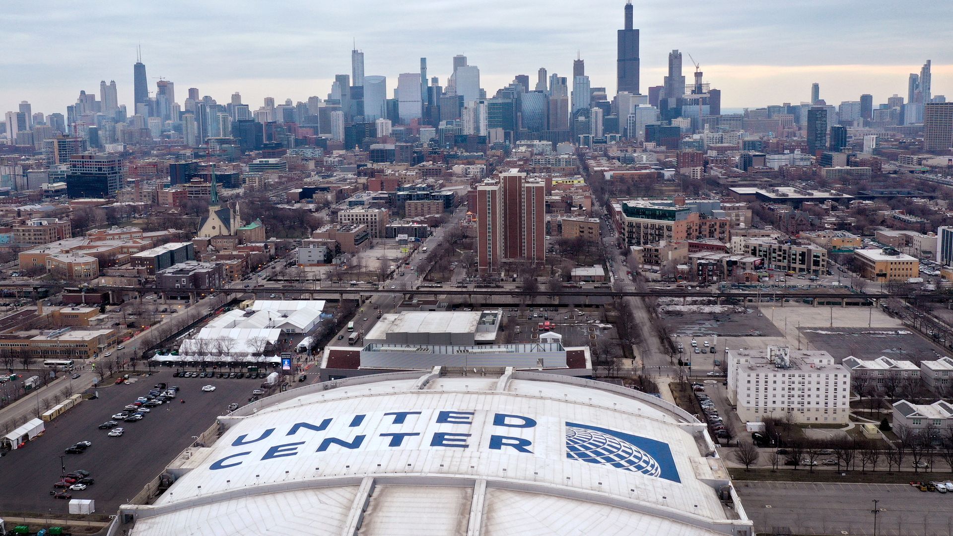Photo of a roof of a stadium and a skyline 