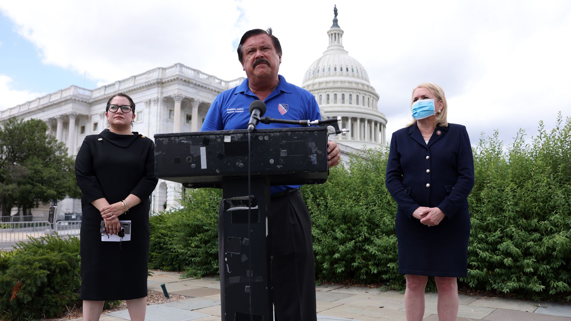 ULAC National President Domingo Garcia speaks as LULAC National CEO Sindy Benavides and U.S. Rep. Sylvia Garcia (D-TX) listen during a news conference July 10, 2020.