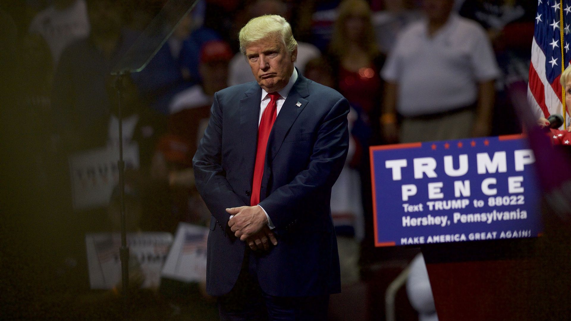Donald Trump frowns at a campaign rally