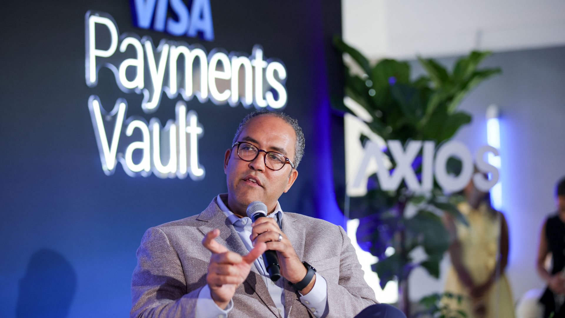 Image of former Congressman Will Hurd speaking on stage at an Axios reception