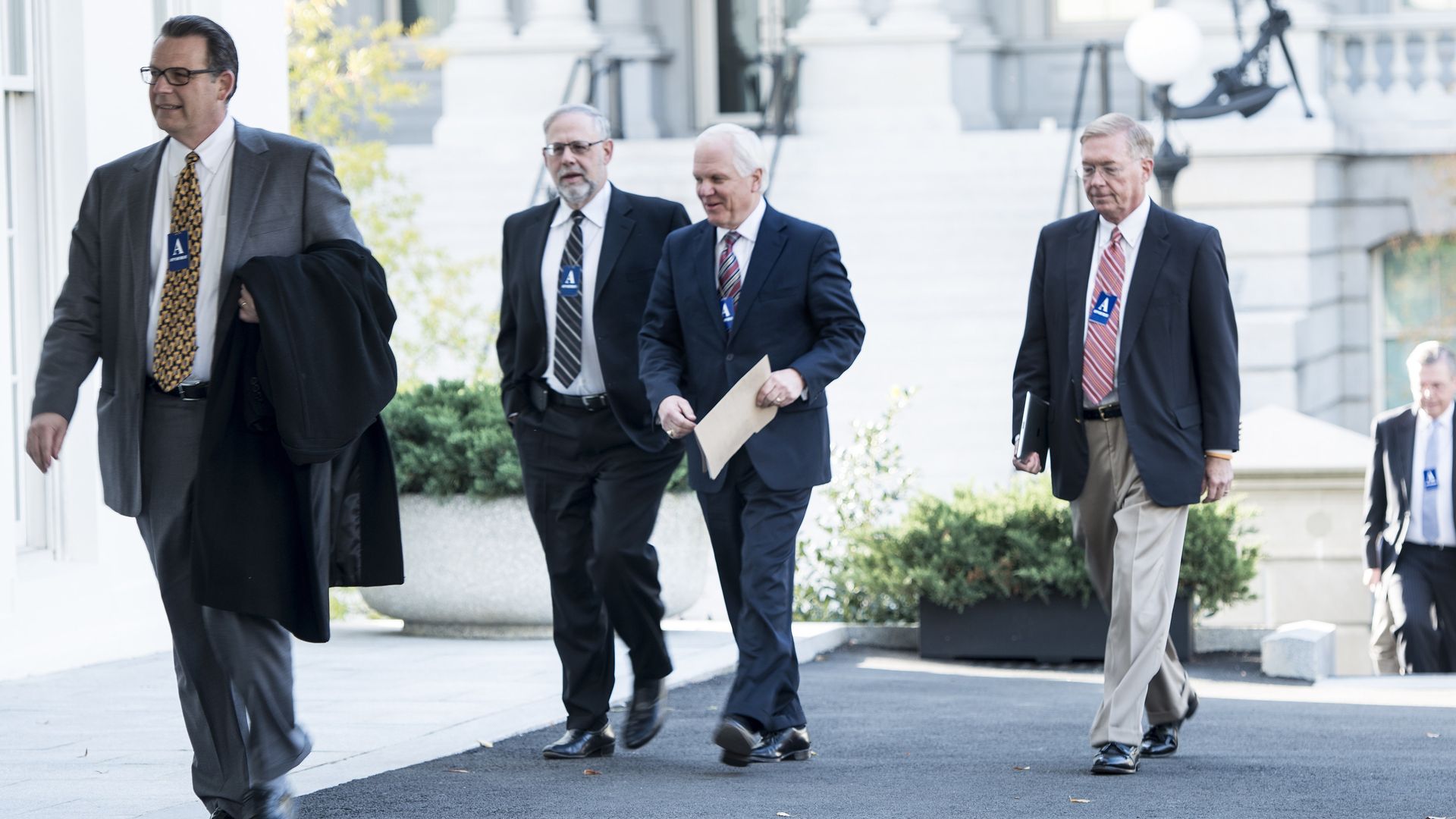 Joseph Swedish and other health insurance executives walk into the White House.