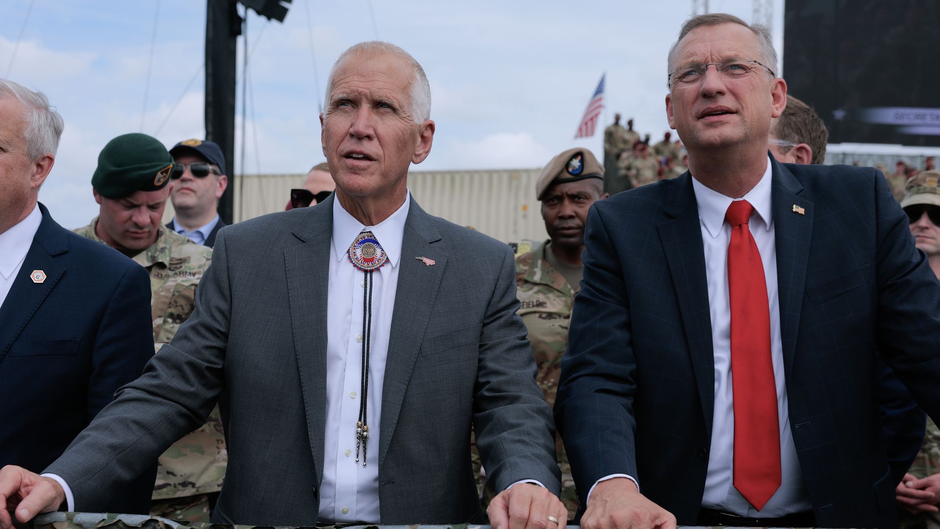 FORT BRAGG, NORTH CAROLINA - JUNE 10: Sen. Thom Tillis (R-NC) (L) and Veterans Affairs Secretary Doug Collins listen to U.S. Defense Secretary Pete Hegseth address a rally with U.S. Army troops on June 10, 2025 at Fort Bragg, North Carolina. Hegseth and President Donald Trump are travelling to Fort 