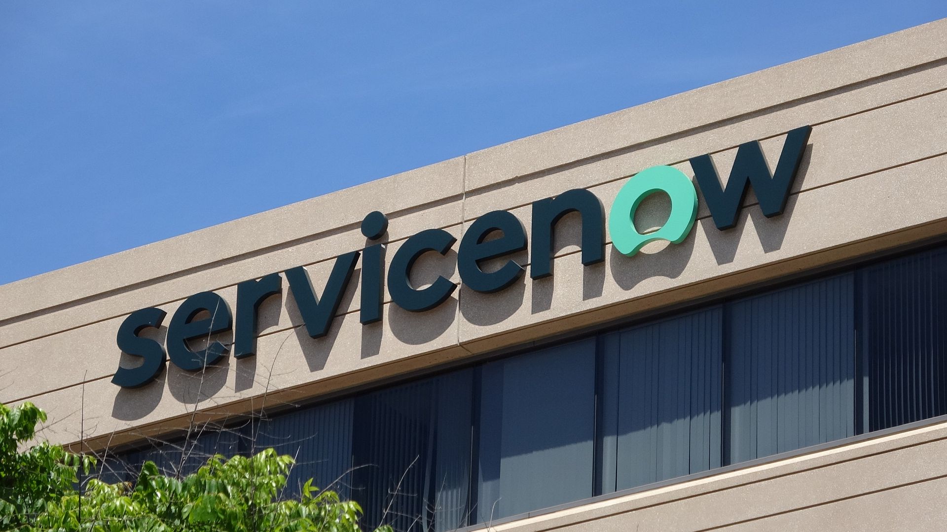 Picture of the ServiceNow logo on the side of a building