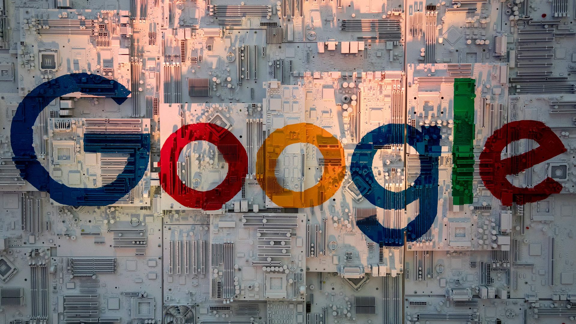 The Google logo overlayed on computer chips at a data center
