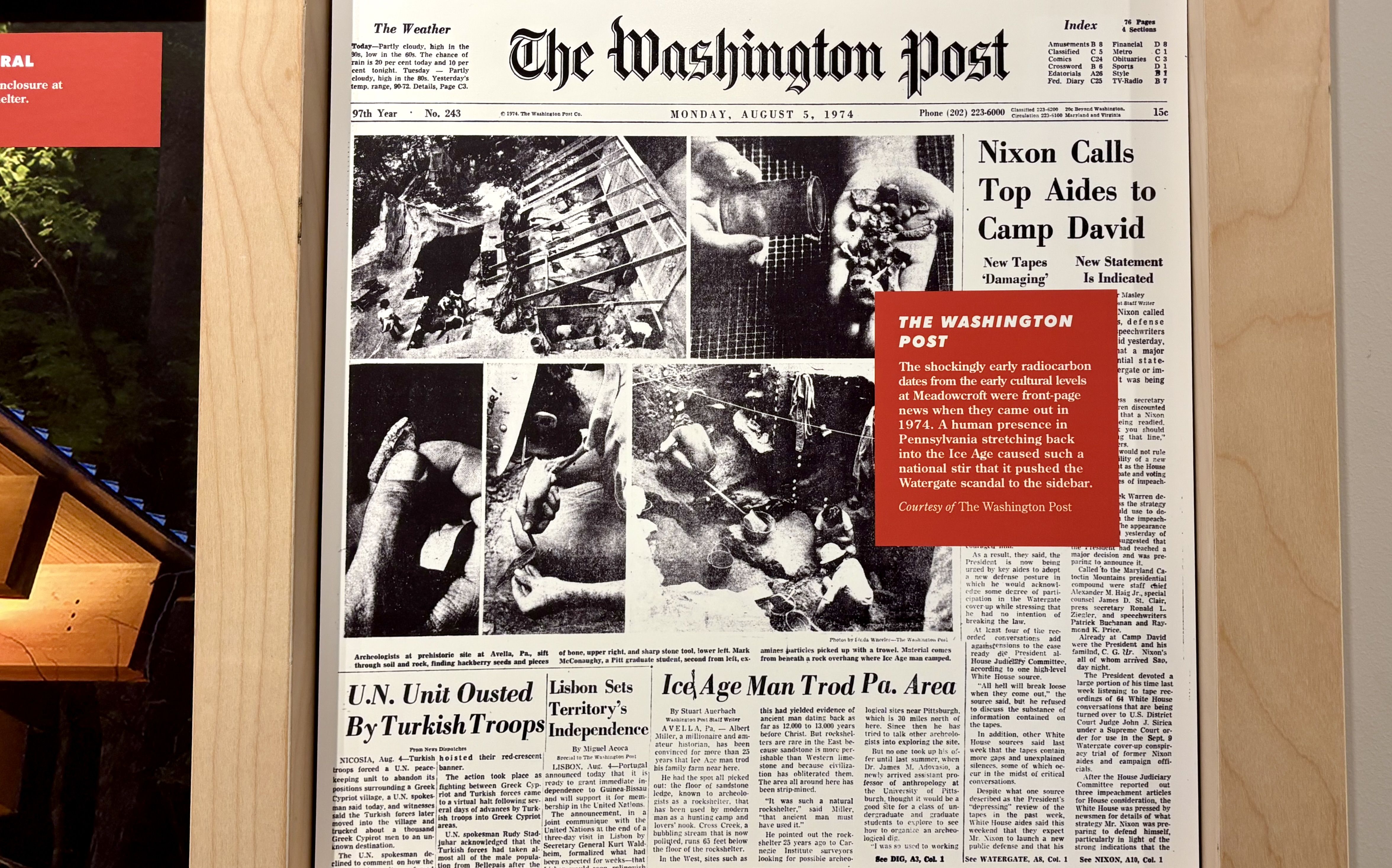 Framed black-and-white front page of The Washington Post dated August 5, 1974, with a bold headline about top aides to Camp David; a red overlay card covers part of the page.
