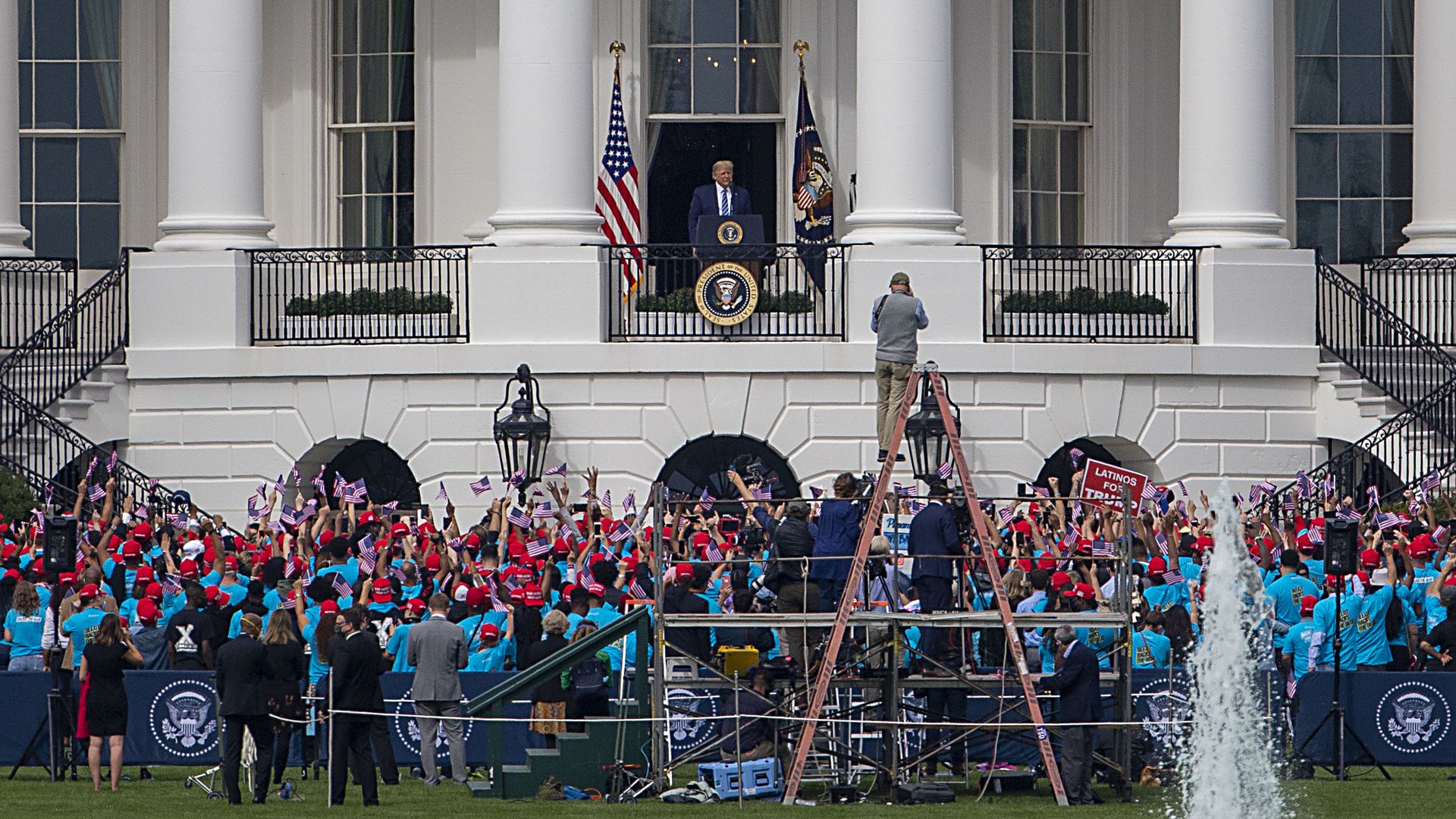 Trump on the Blue Room Balcony before a crowd of supporters on Oct. 10.