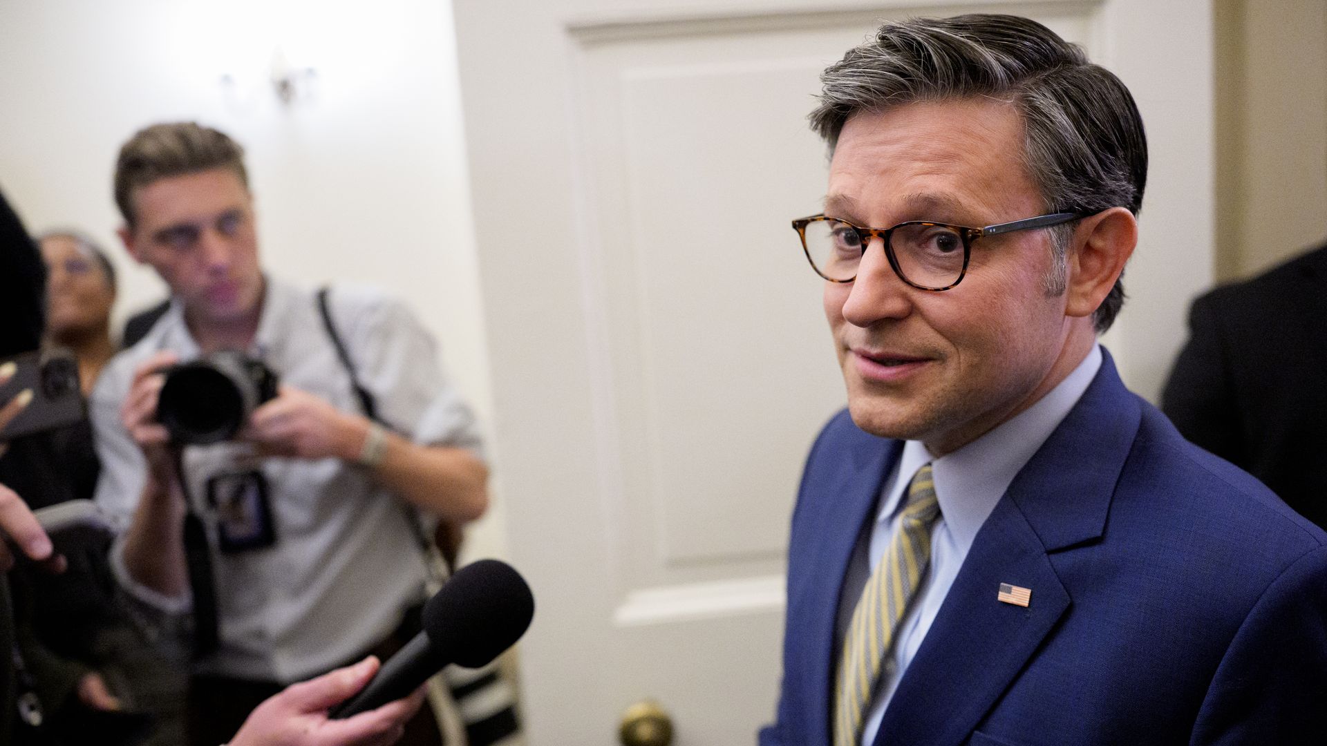 House Speaker Mike Johnson talks to reporters at the Capitol