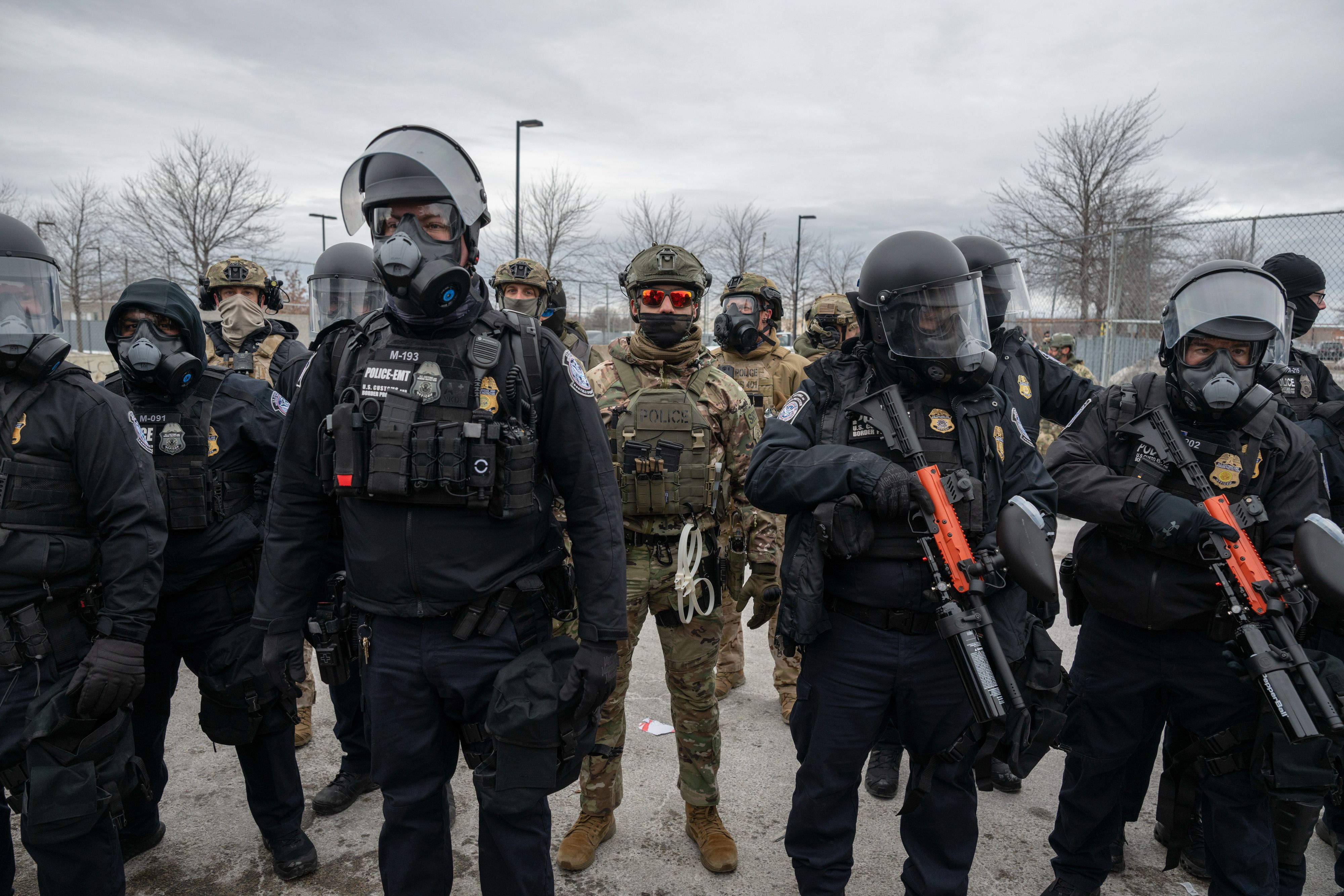Federal law enforcement officers attempt to disperse demonstrators protesting Immigration and Customs Enforcement (ICE) activity outside the Bishop Henry Whipple Federal Building in St. Paul, Minnesota, US, on Thursday, Jan. 15, 2026. President Donald Trump threatened to deploy US military forces to