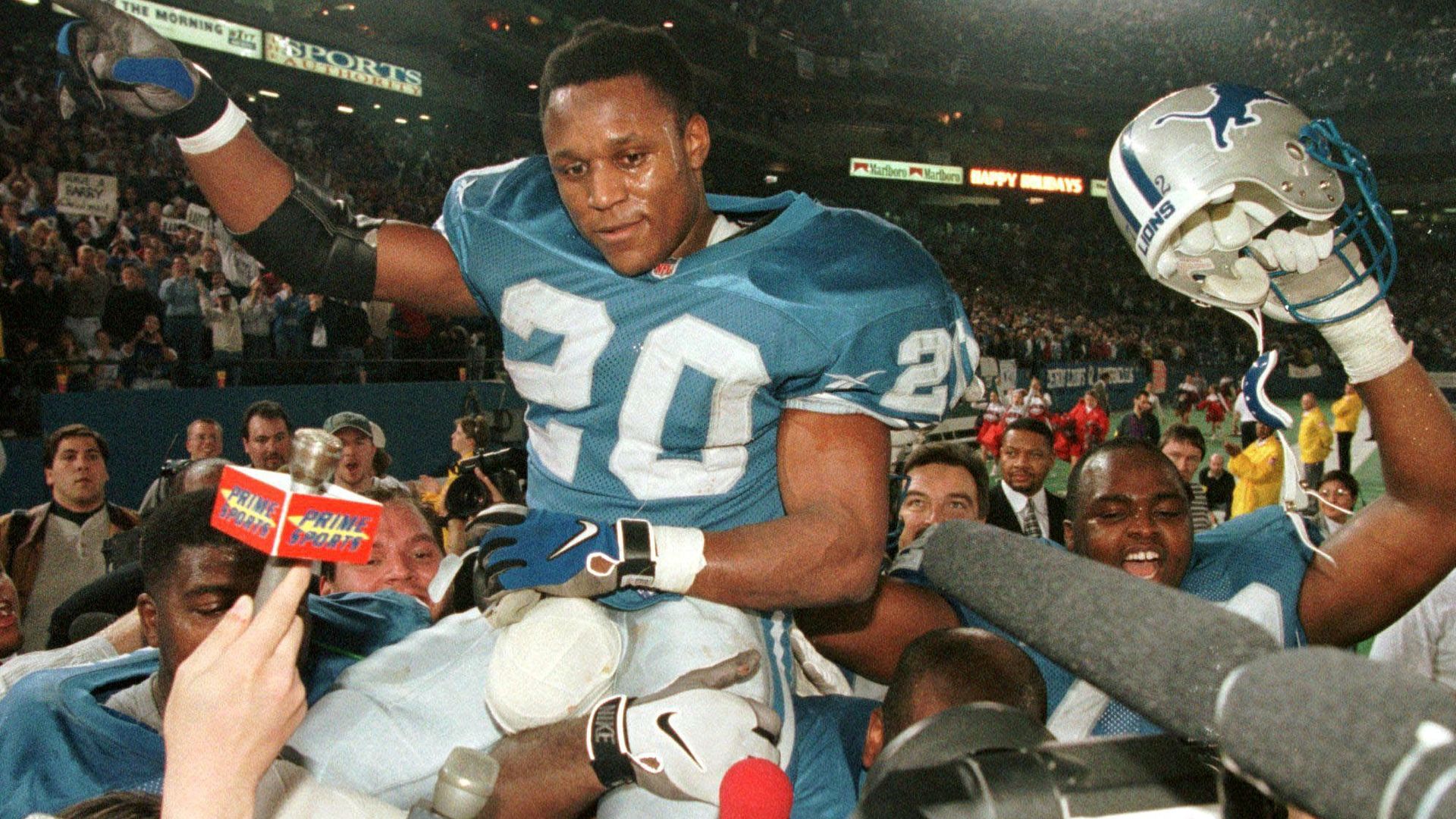 Barry Sanders is carried off of the field at the Silverdome by his teammates after he rushed for over 2,000 yards in a season in 1997.