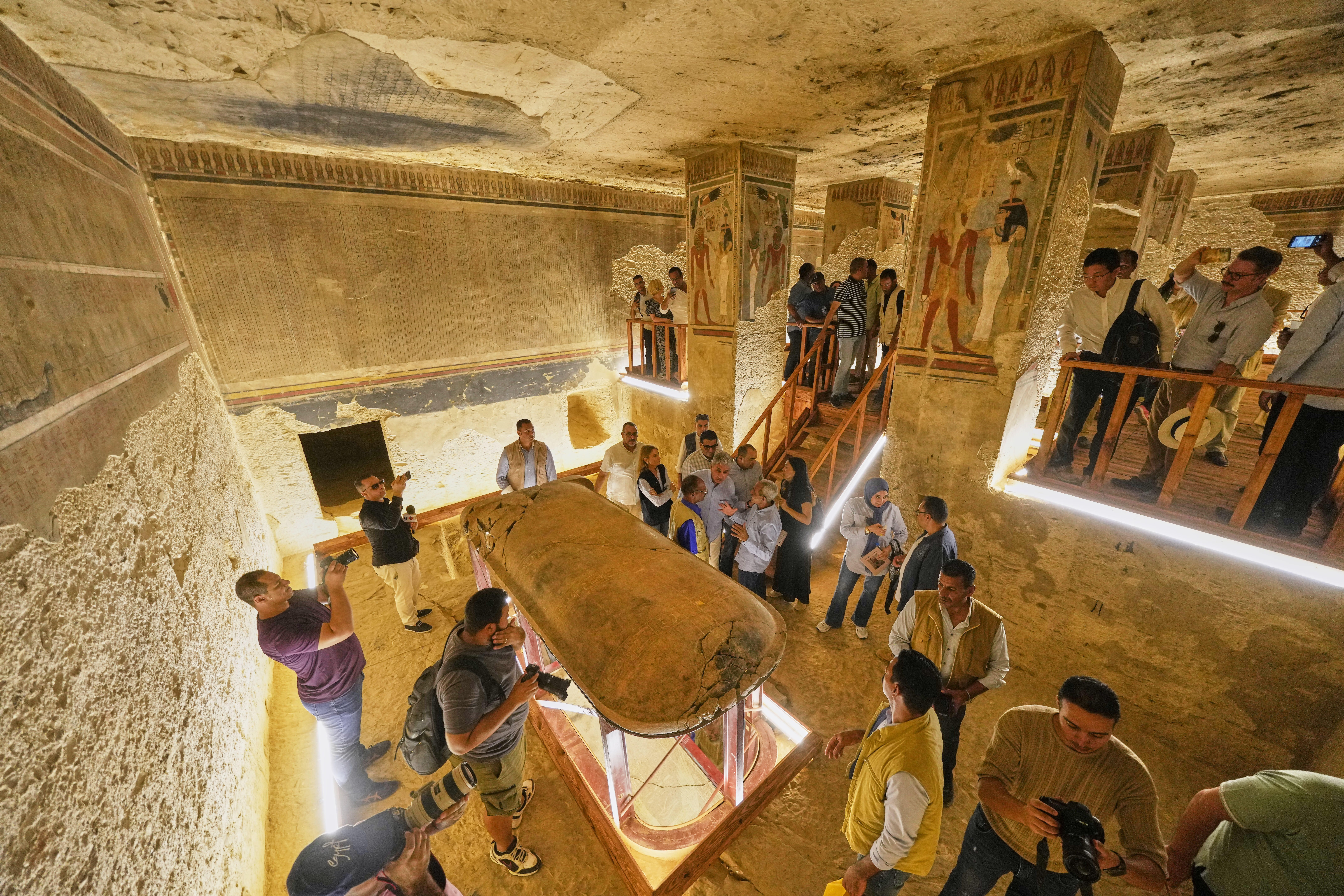 Visitors view the tomb of Amenhotep III, who ruled ancient Egypt between 1390 B.C. and 1350 B.C., in the Valley of Kings in the southern city of Luxor, Egypt, Saturday, Oct. 4, 2025, as it opened to visitors for the first time in more than two decades. (AP Photo/Amr Nabil)
