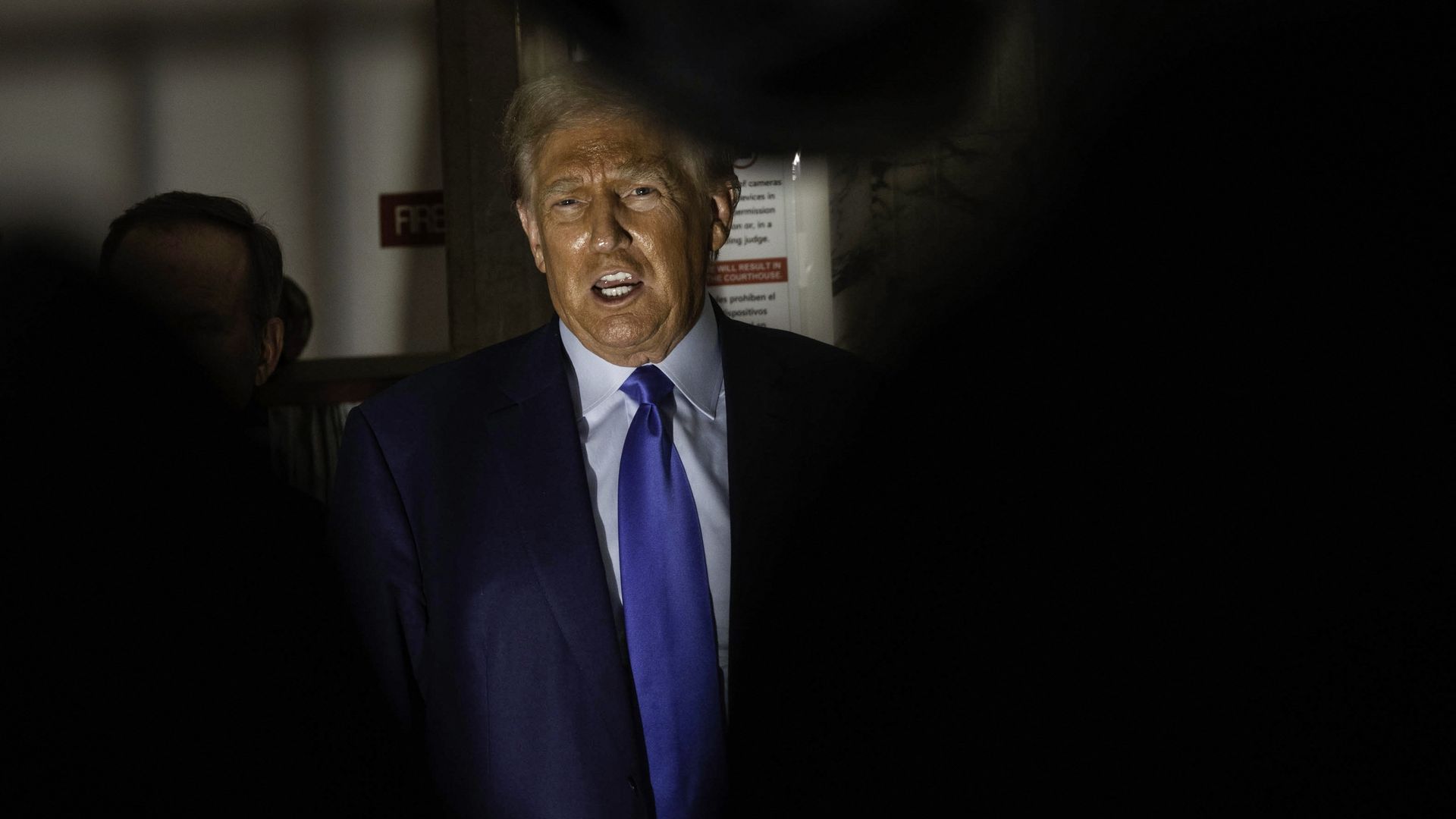 Former US President Trump addresses the media before leaving the courthouse for the day in New York City on October 24, 2023.