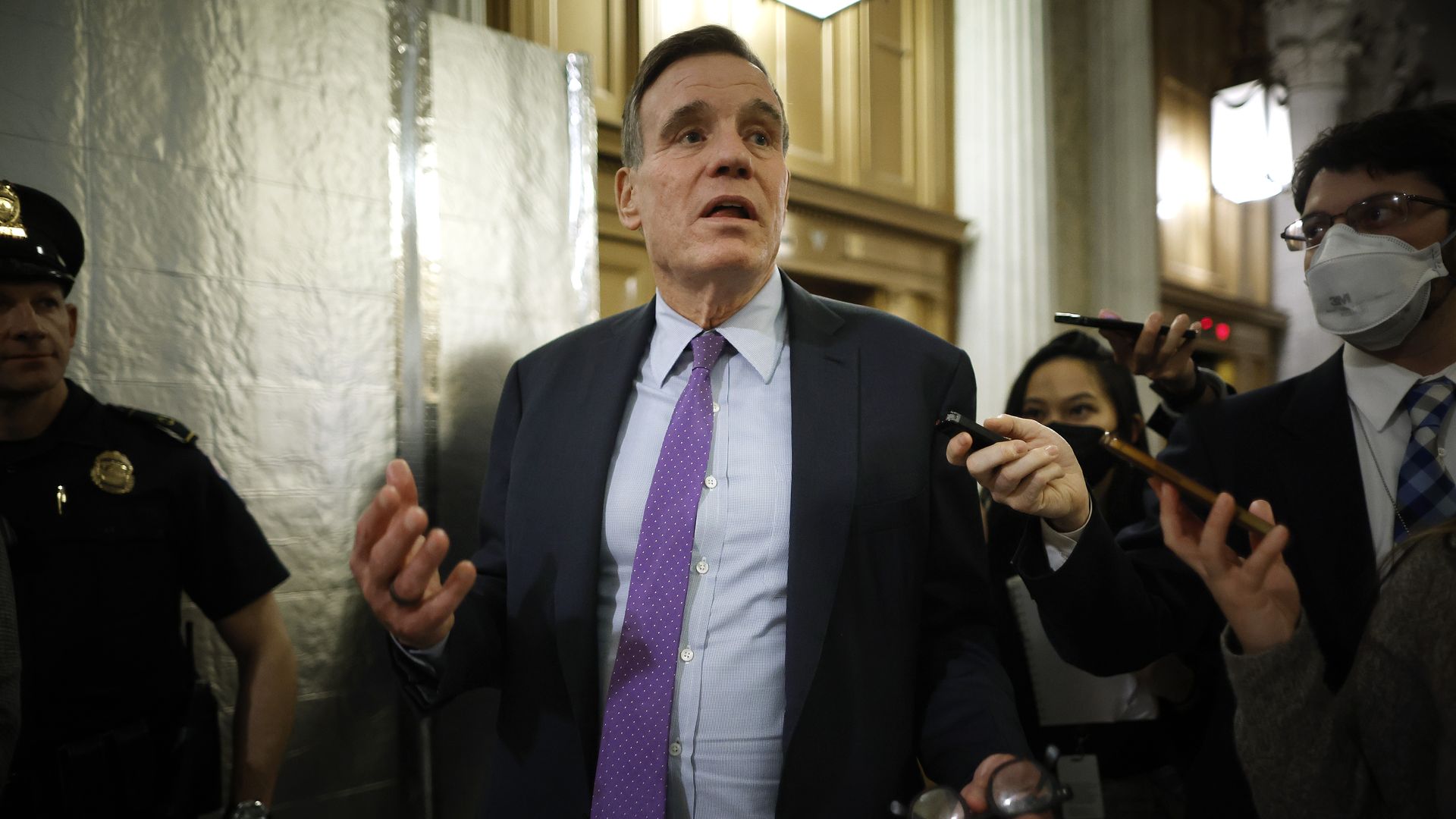 Sen. Mark Warner (D-VA) talks to reporters as he heads for the Senate Chamber for a procedural vote on the bipartisan federal omnibus spending legislation at the U.S. Capitol on December 20, 2022