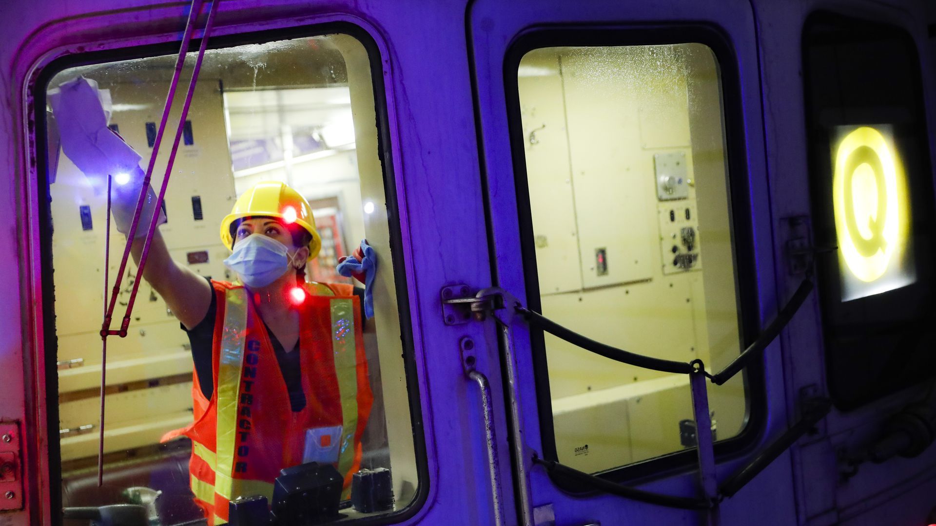 A contractor cleans a subway car at the 96th Street station in NYC. 