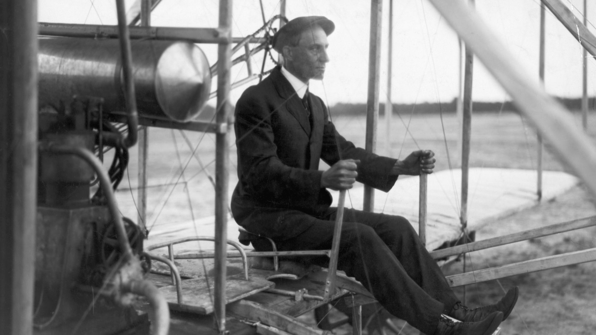 Wilbur Wright in his airplane during flight in France, 1908.