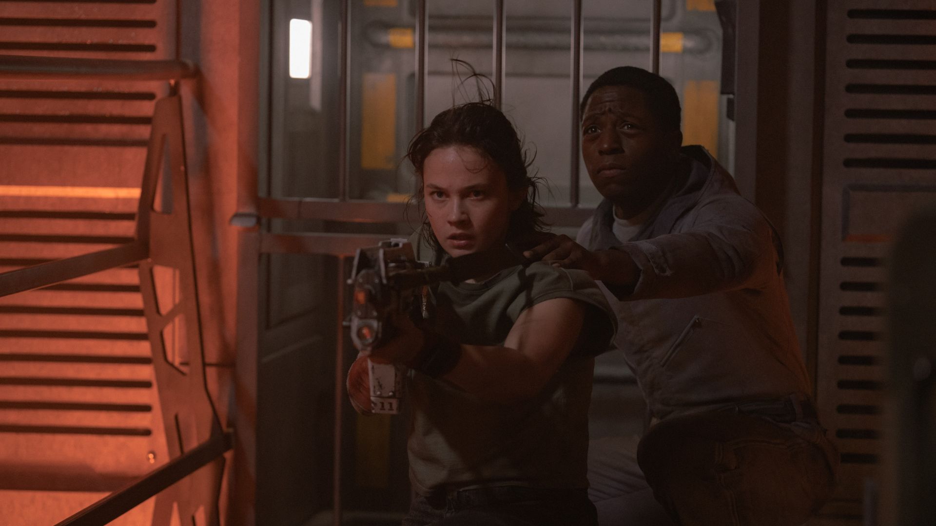 Actors Cailee Spaeny and David Johnson brace themselves in  "Alien: Romulus."