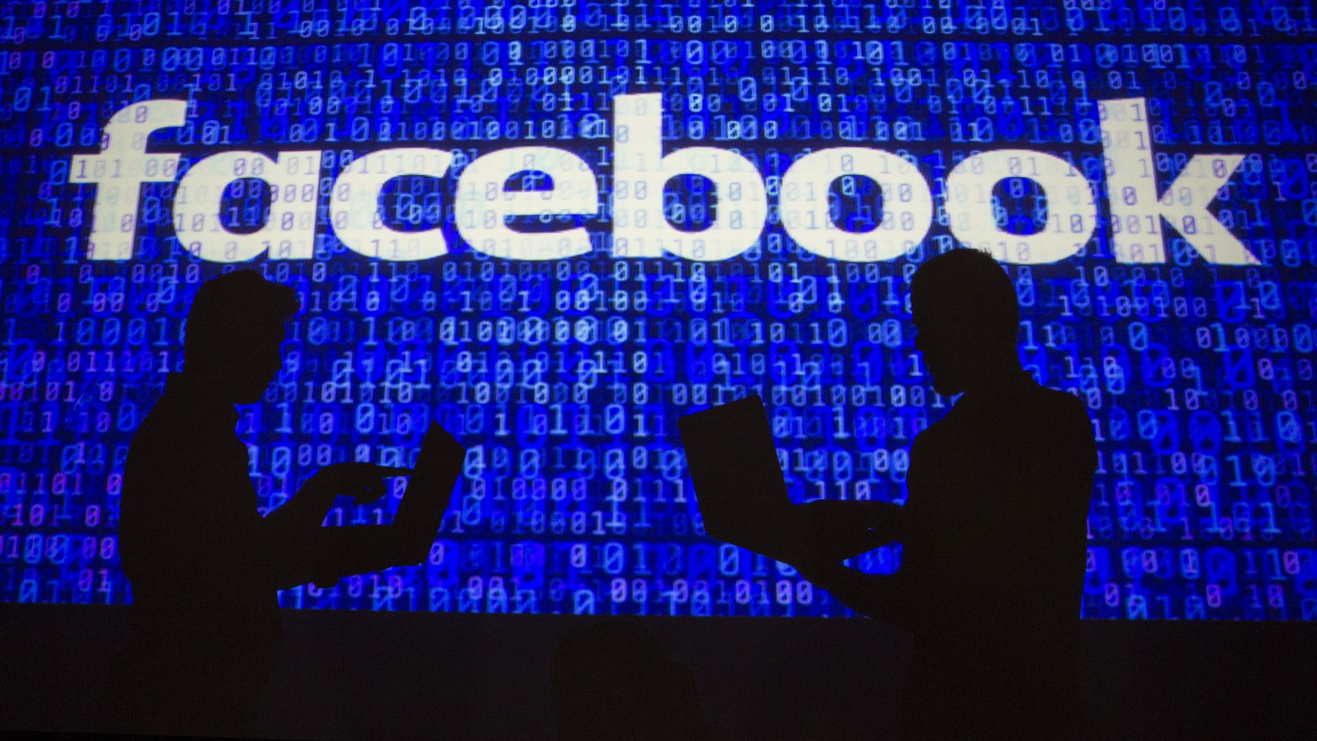 Facebook logo with shadowy figures in front of it