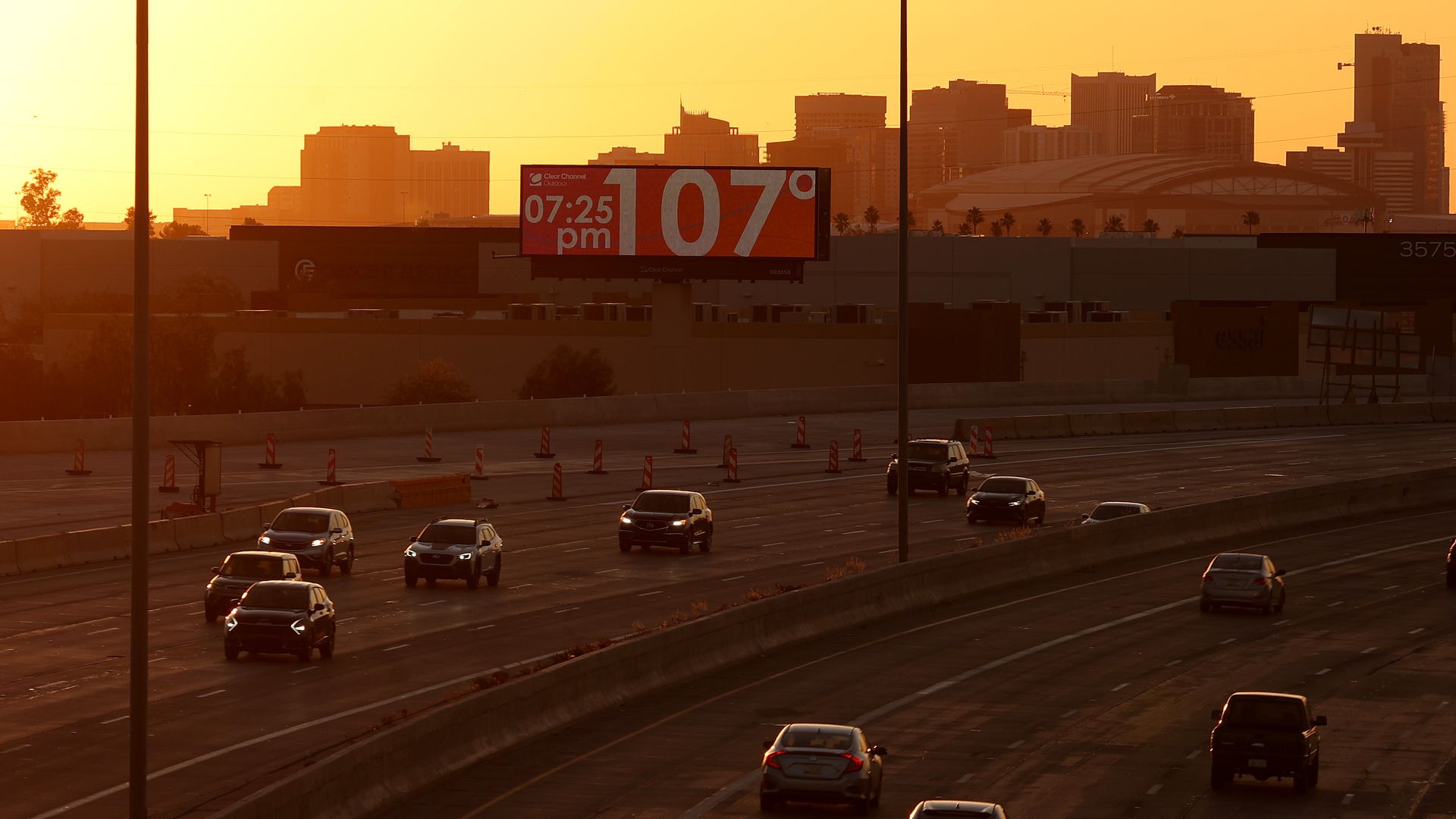 A billboard showing a temperature of 107. 