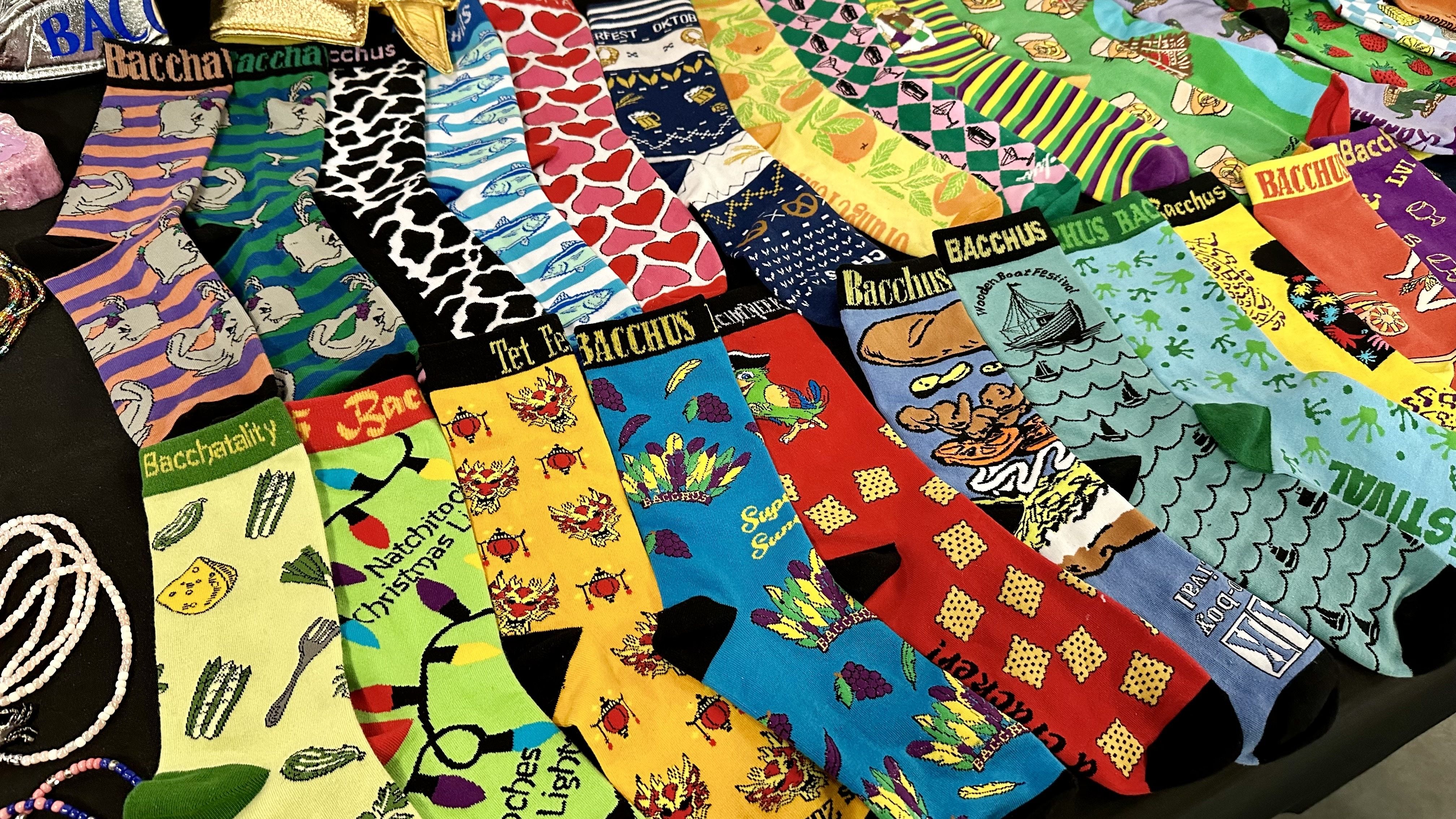 A table is laid with dozens of different Bacchus socks.