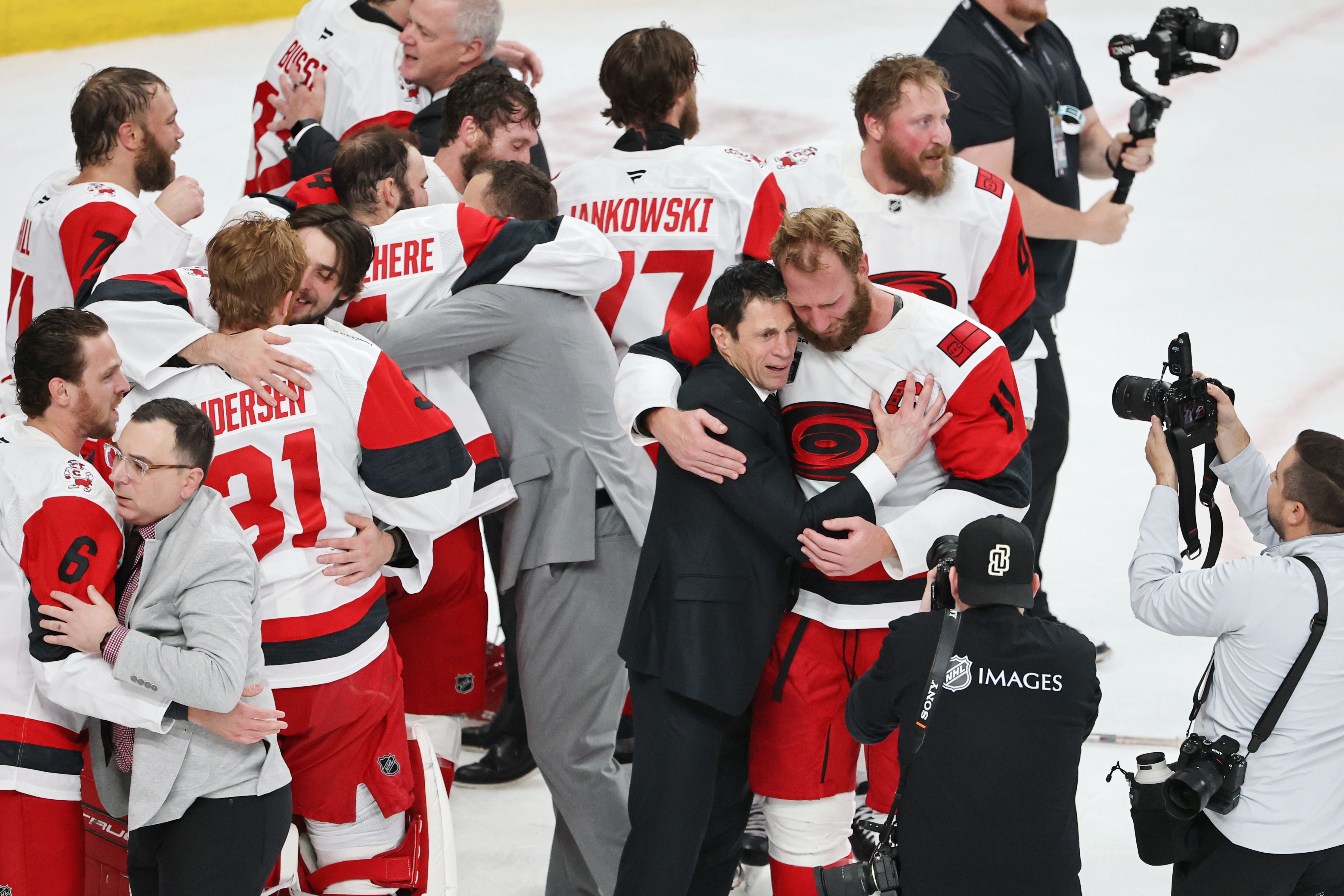 LAS VEGAS, NEVADA - JUNE 14: Jordan Staal #11 of the Carolina Hurricanes and head coach Rod Brind'Amour of the Carolina Hurricanes hug after winning Game Six of the 2026 Stanley Cup Final.