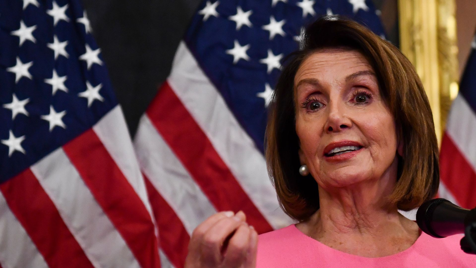 Nancy Pelosi gestures and looks exasperated.