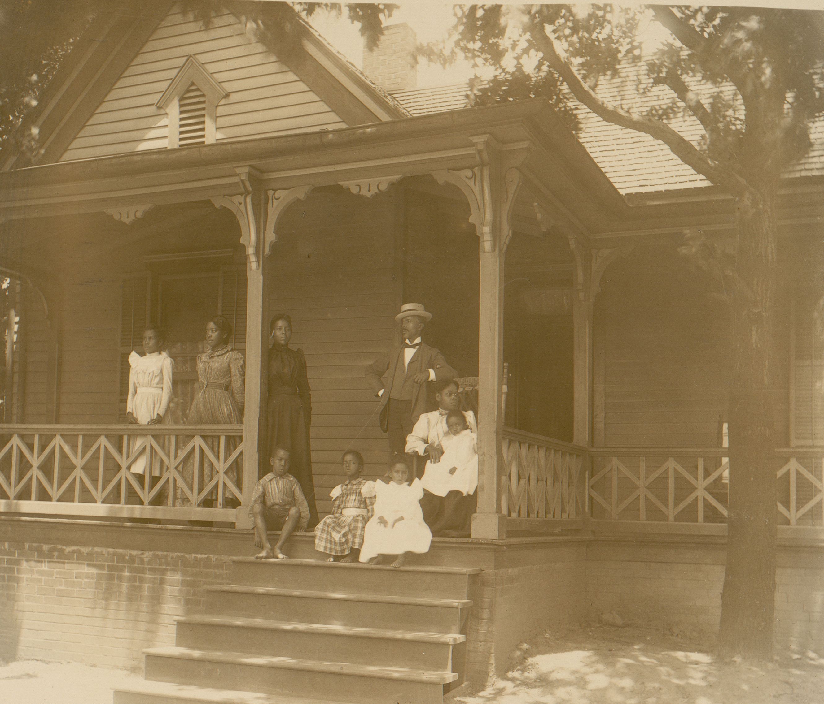 UNITED STATES - CIRCA 1899: Home of an African American lawyer, Atlanta, Georgia, with men, women, and children posed on porch of house (Photo by Buyenlarge/Getty Images)