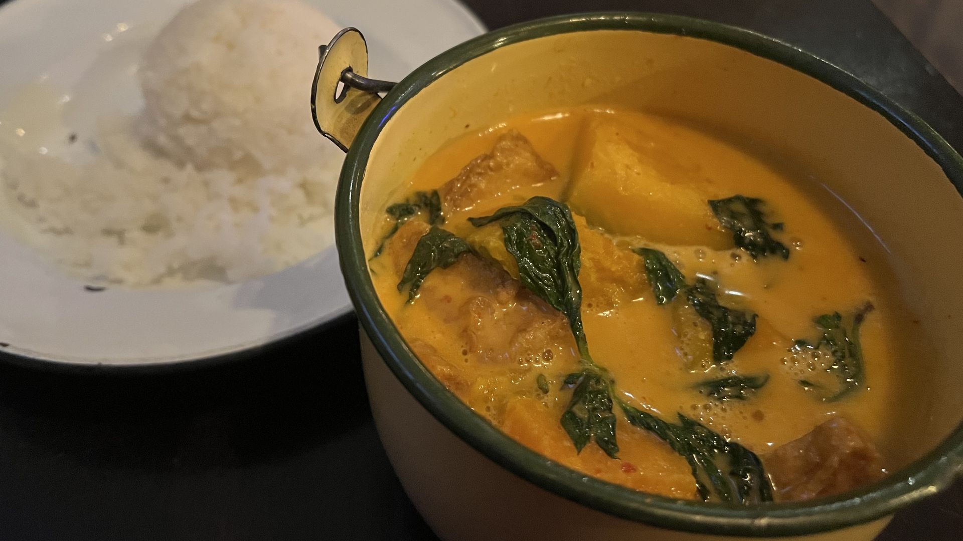 Photo of a yellow curry and rice. 