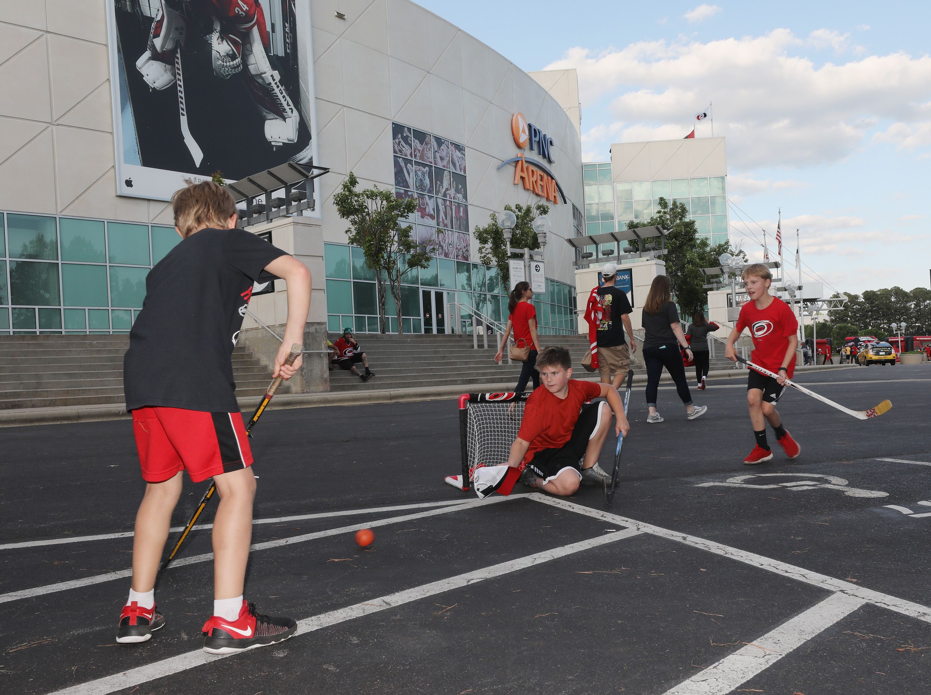 Kids playing hockey outside the stadium