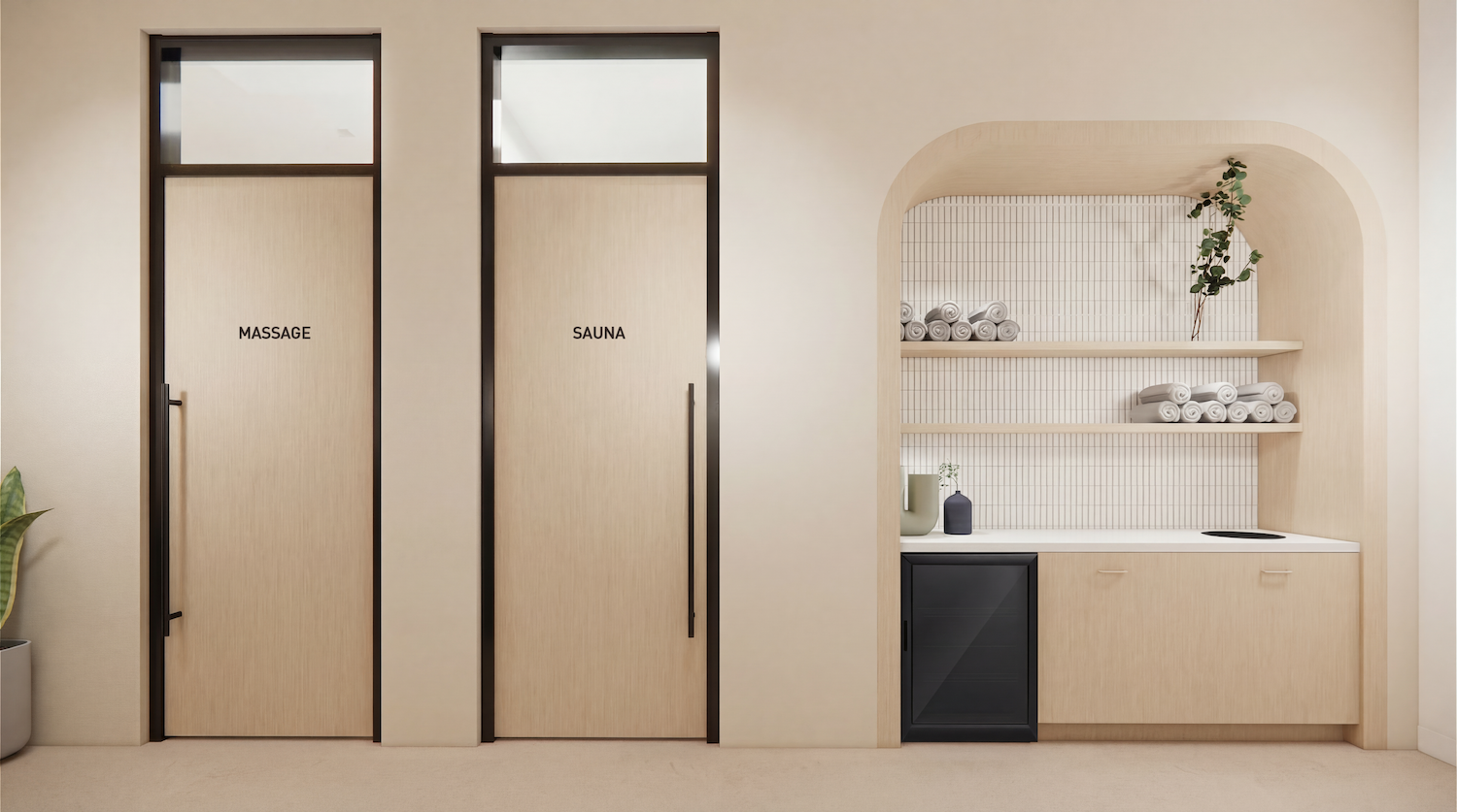 Serene spa entry with two beige doors labeled MASSAGE and SAUNA, plus a curved alcove featuring tiled shelves, neatly rolled towels, a plant, and a small counter with a mini fridge.