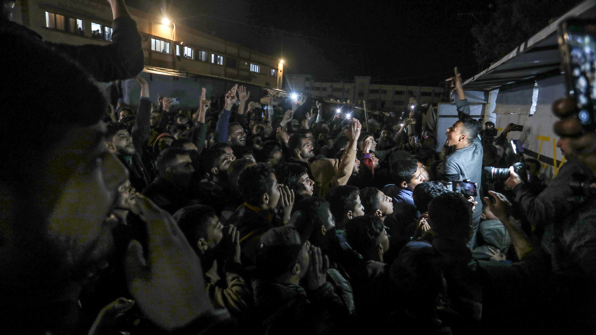 Palestinians celebrate in the streets of Khan Younis on Jan. 15, 2025, following the announcement of a ceasefire agreement between Israel and Hamas. 