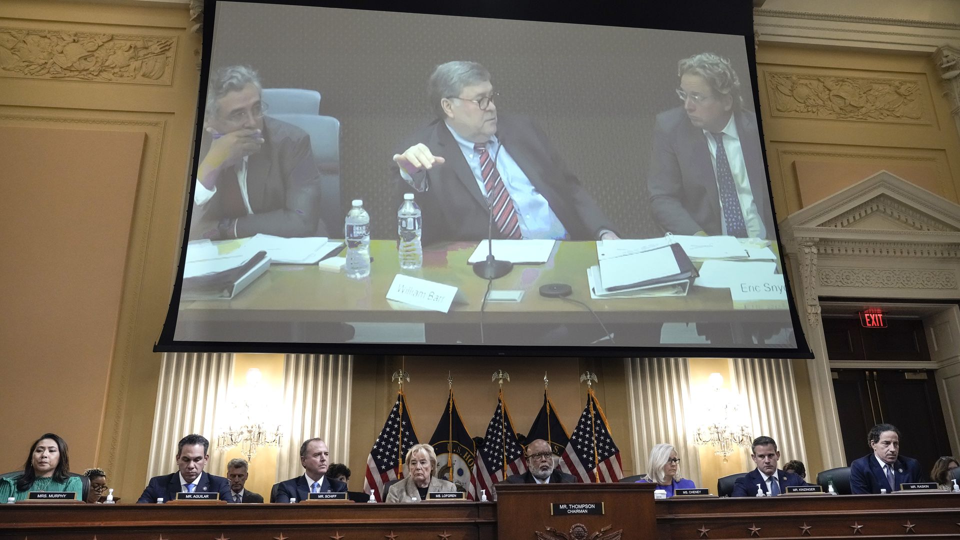 Bill Barr video on large screen above panelist heads.