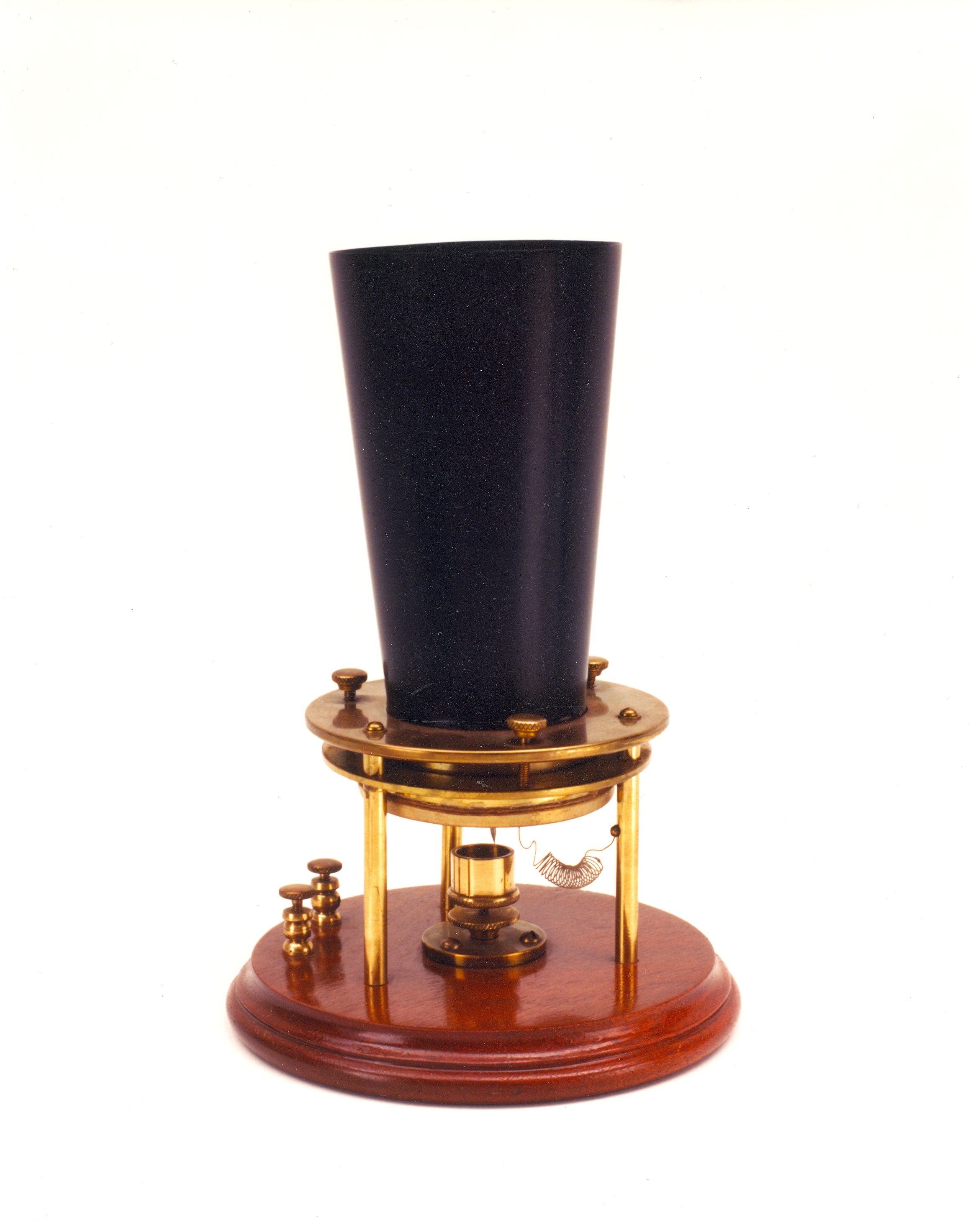 The phone used in that first call was a cone-shaped device with a liquid transmitter that conducted Bell's voice, turned it into an analog signal, and passed it through a phone wire connected to a receiver in another room.