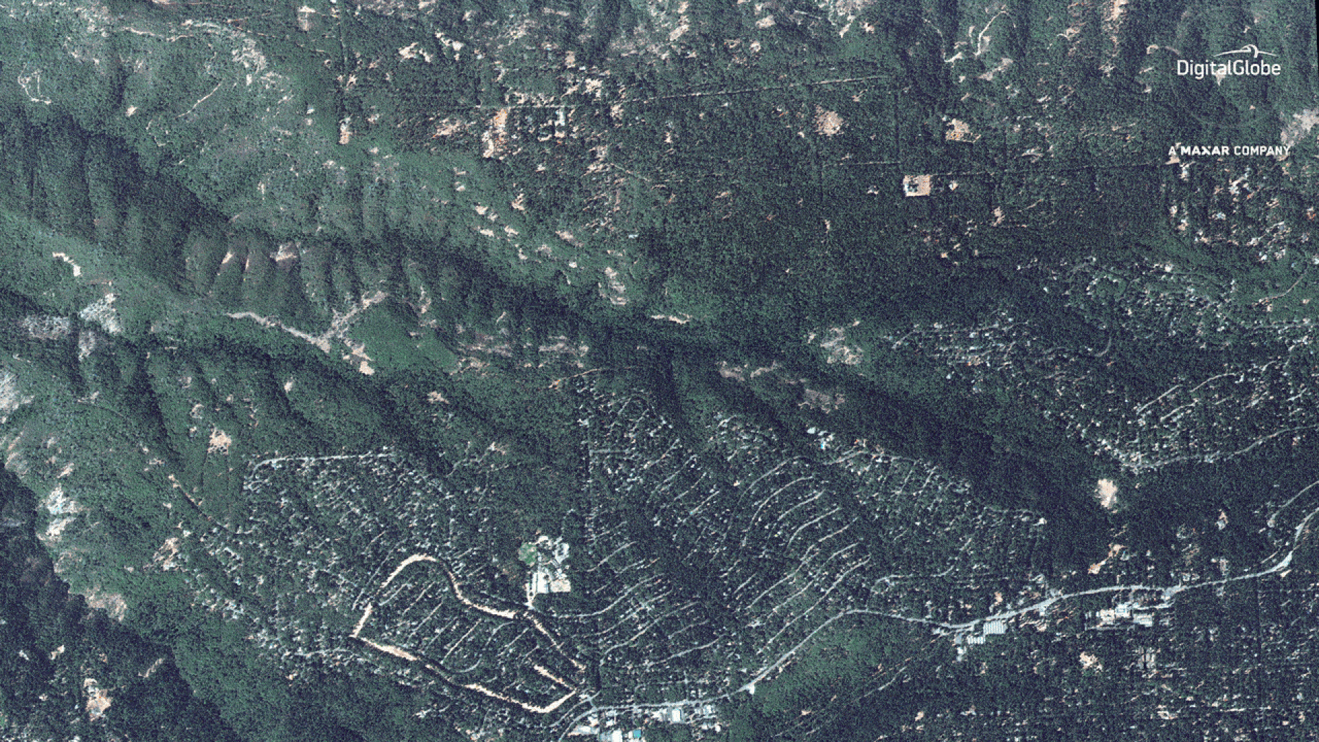 Satellite images of Paradise, California, showing the community before and during the Camp Fire.