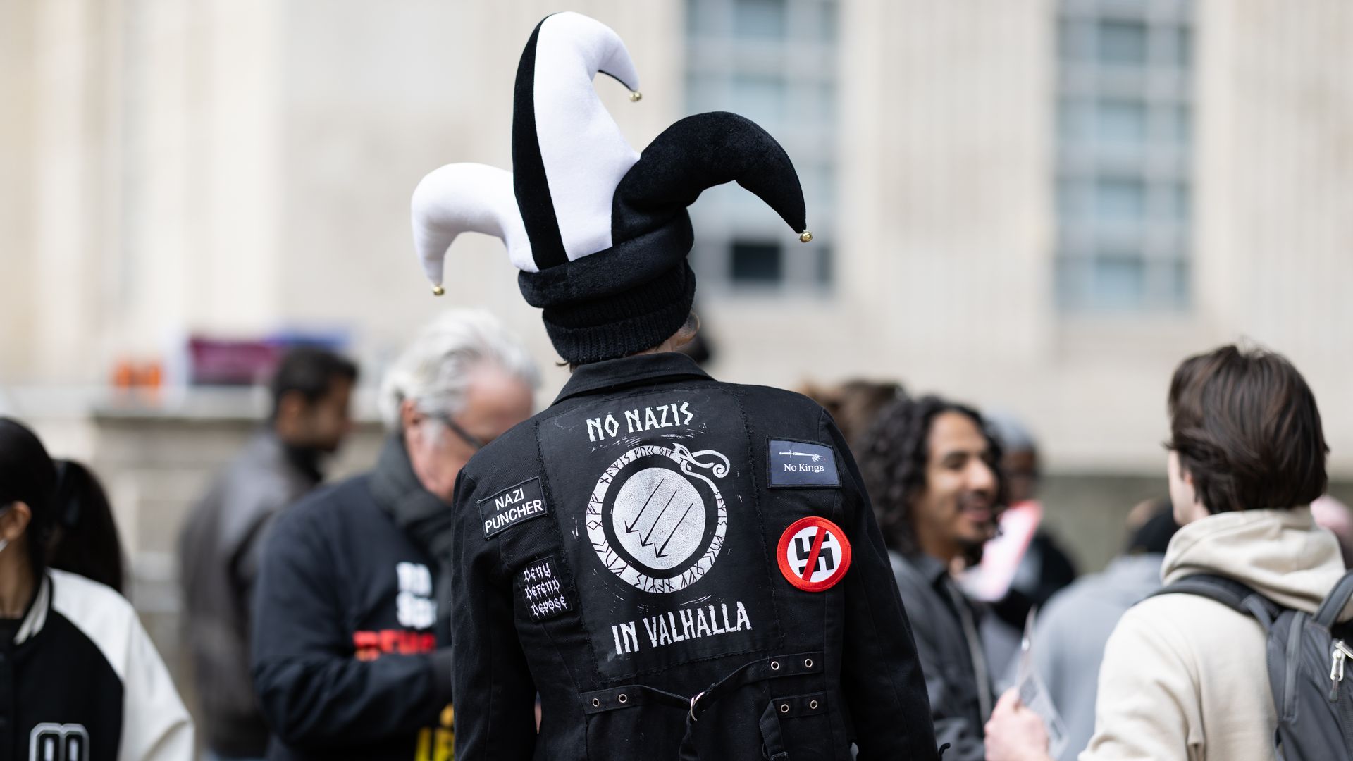 A man wears a patch on the back of his jacket that reads, ''No Nazis in Valhalla'' during a demonstration against Immigration and Customs Enforcement (I.C.E.) outside City Hall in Houston, Texas