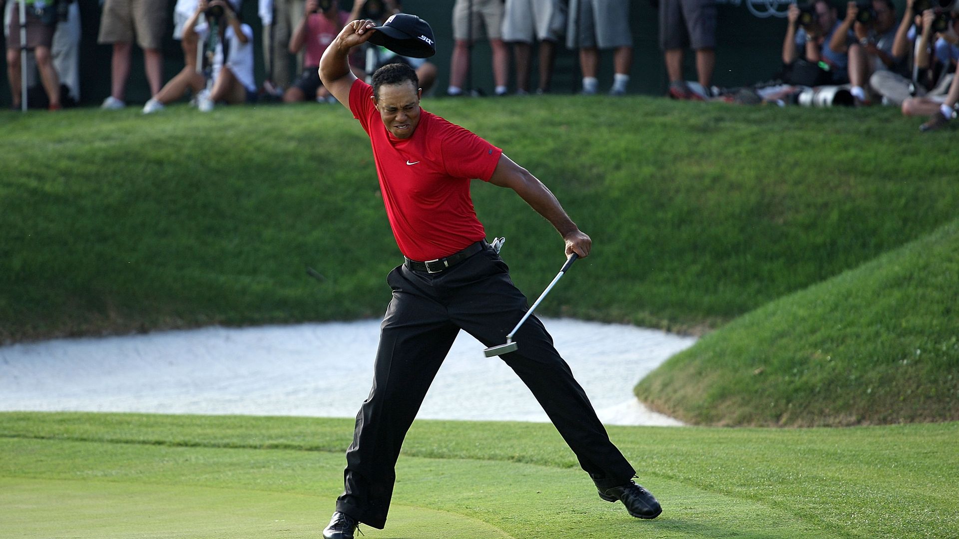 Tiger Woods throwing his hat