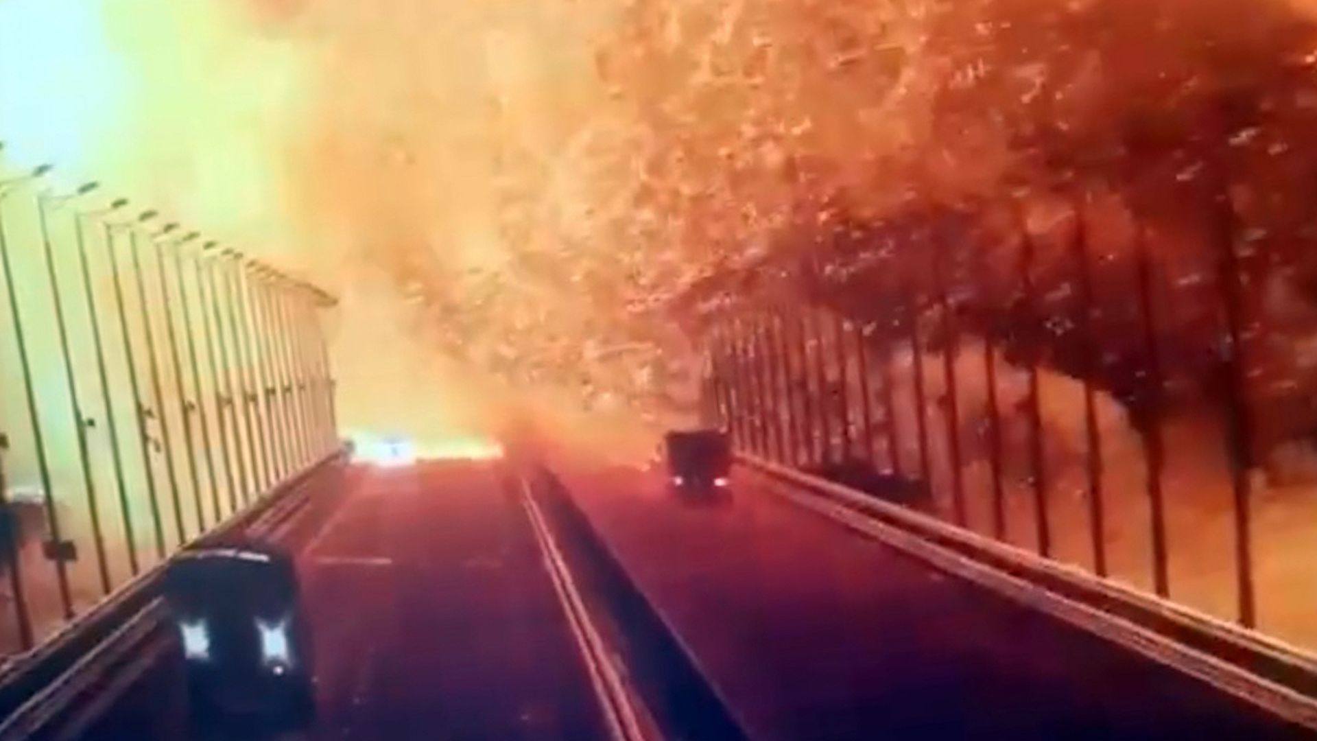  A screen grab from a surveillance footage shows flames and smoke rising up after an explosion at the Kerch bridge.