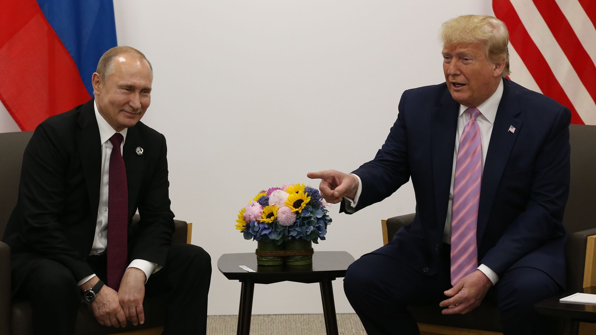 U.S. President Donald Trump (R) and Russian President Vladimir Putin (L) attend their bilateral meeting at the G20 Osaka Summit 2019, in Osaka, Japan