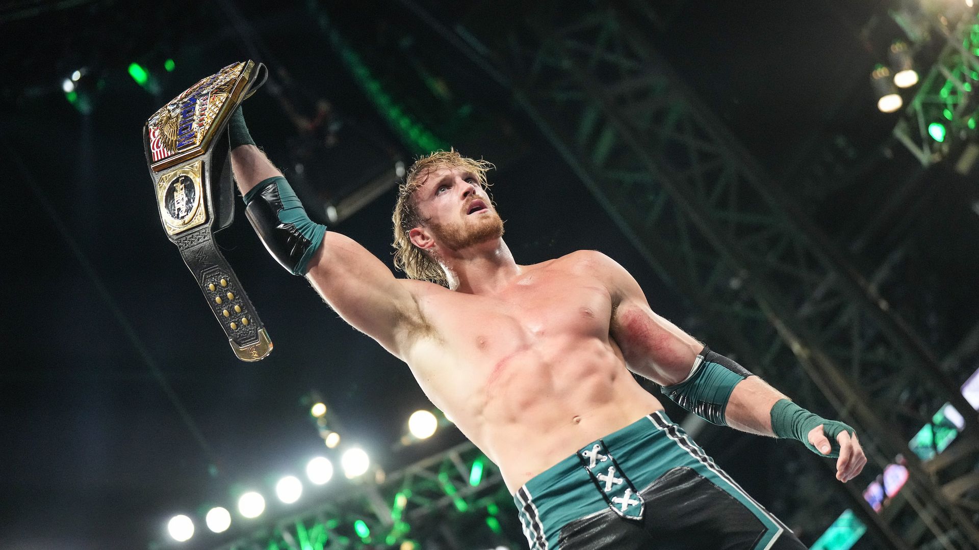 Logan Paul holds up the WWE United States Championship at WrestleMania. 