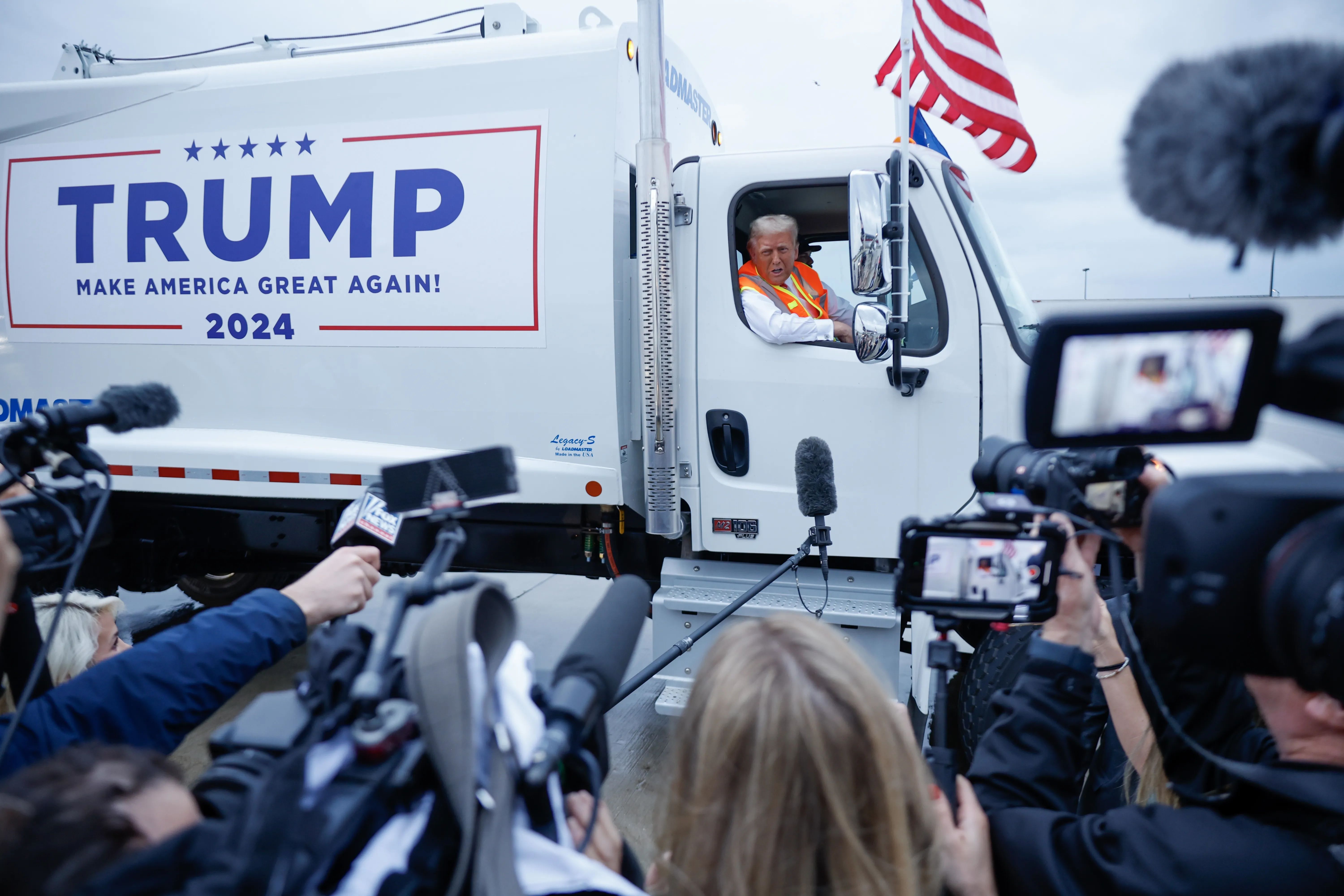 Former President Trump holds a press conference from a garbage truck yesterday in Green Bay, Wis