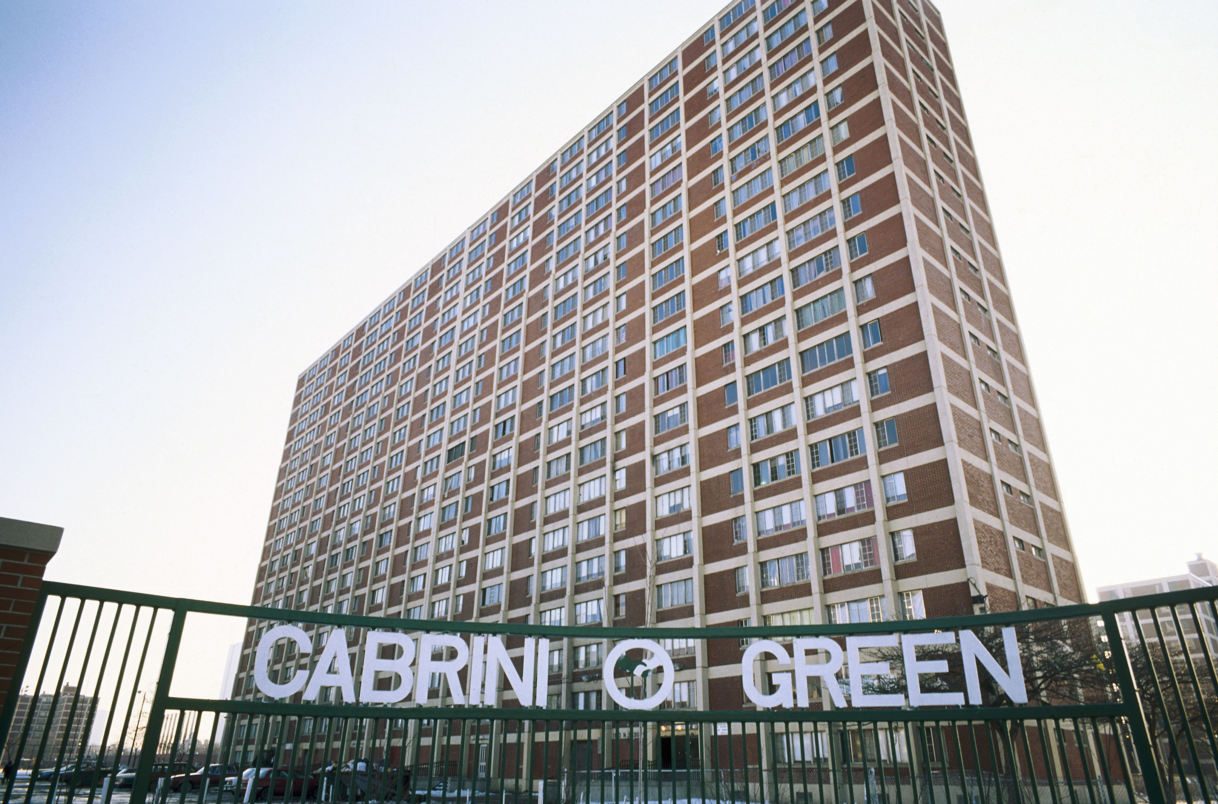Photo of a building with a sign that says "Cabrini Green" 