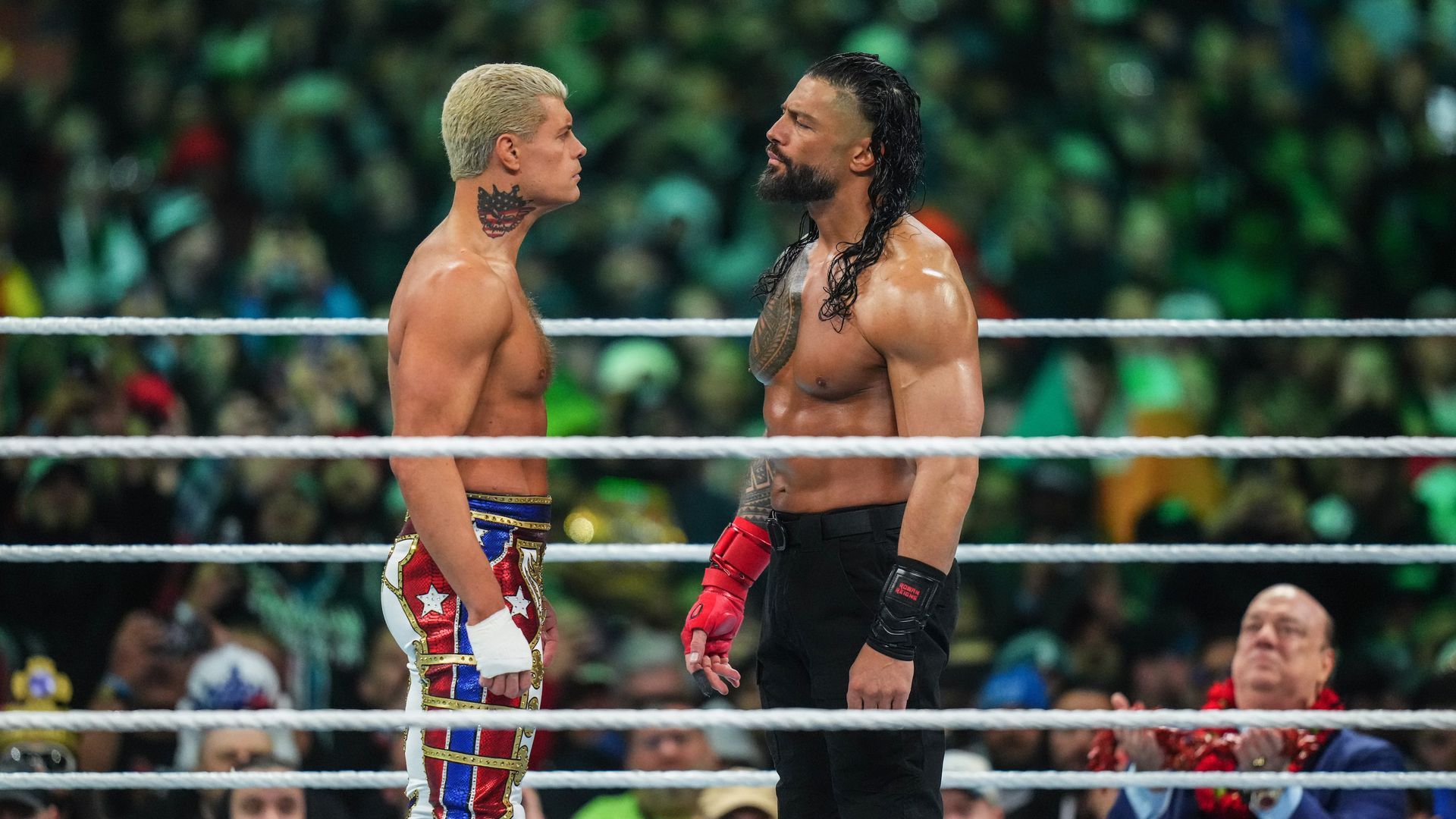Cody Rhodes and Roman Reigns face off. 